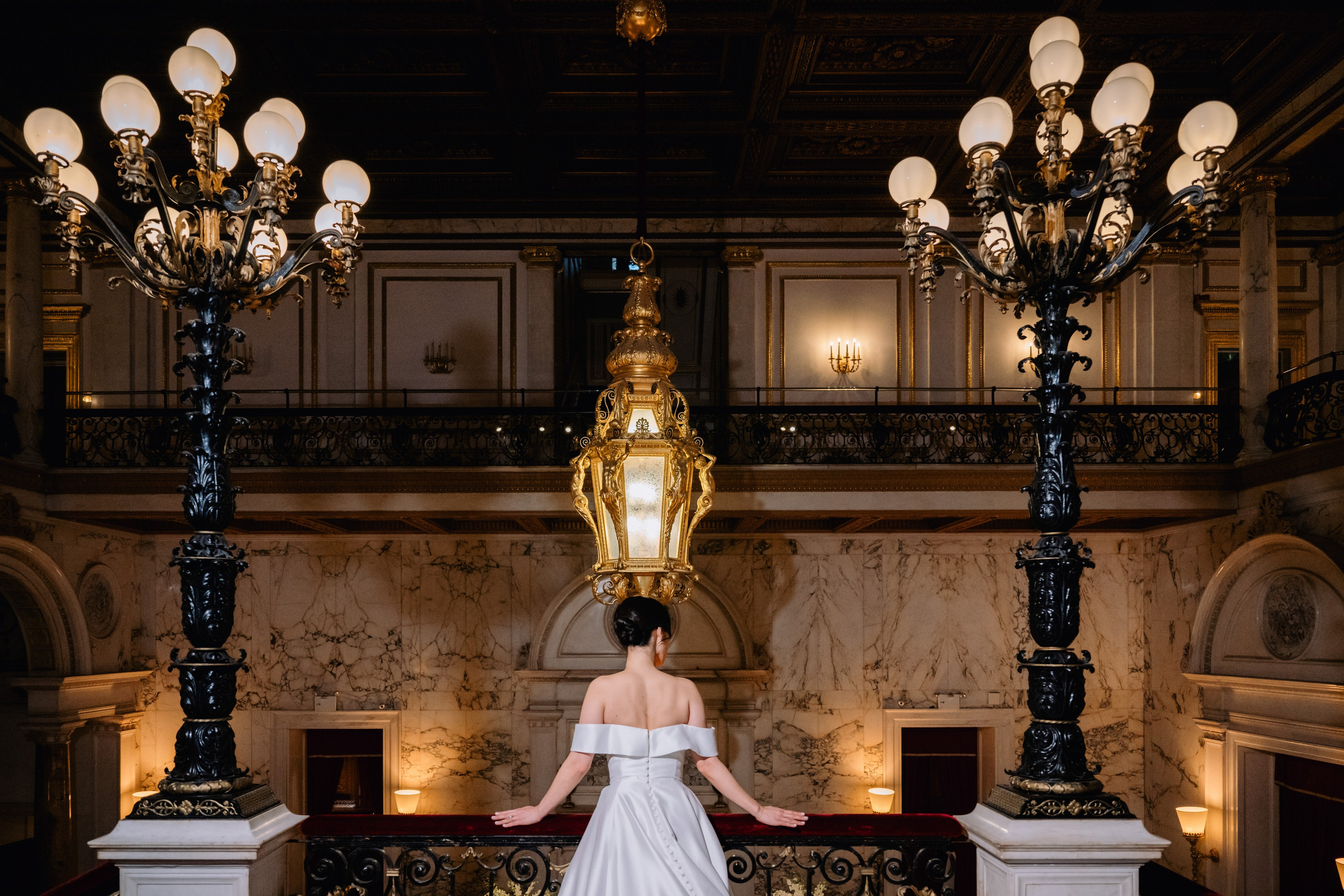 a bride in a white dress standing in a room