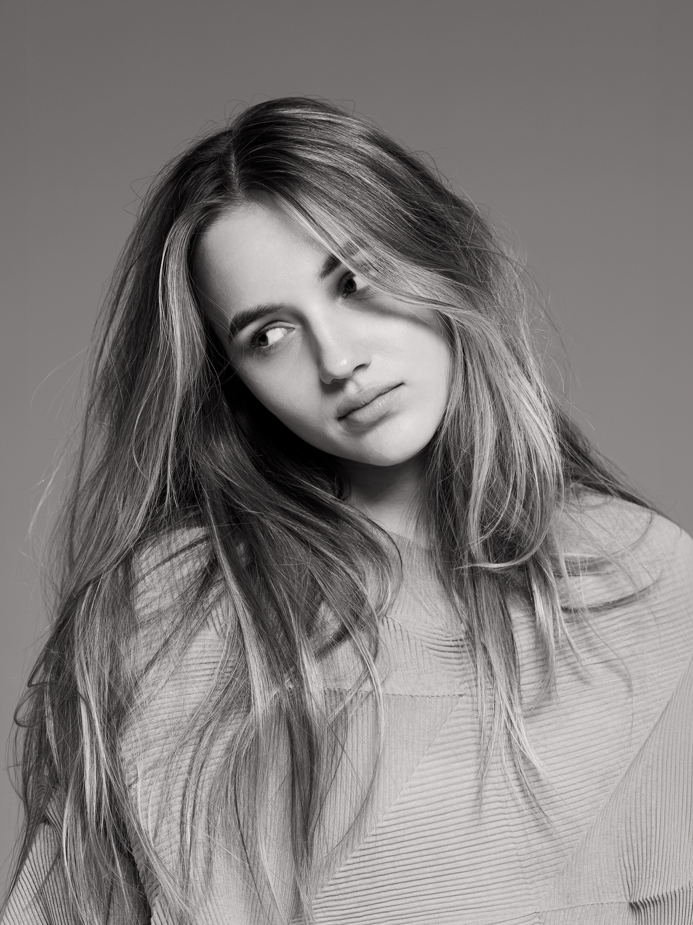 teenage girl studio portrait with long hair, black and white