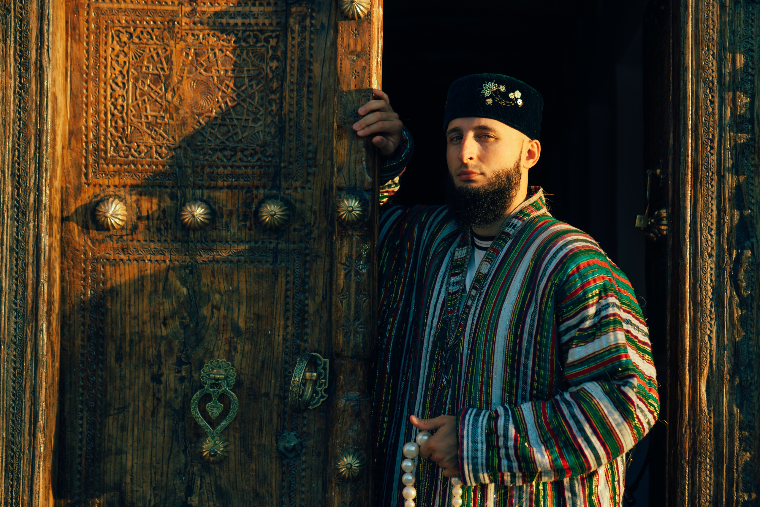 Man's photoshoot in ethnic clothing in Bukhara