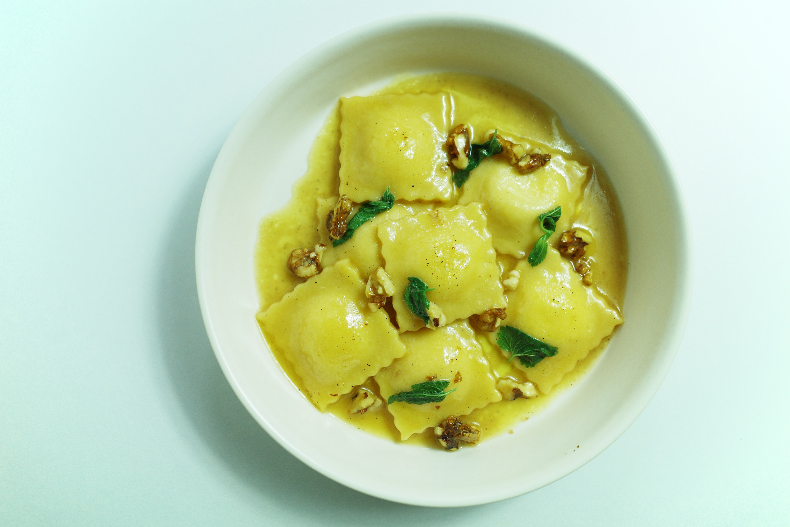 Ravioli with cottage cheese and honey butter sauce.