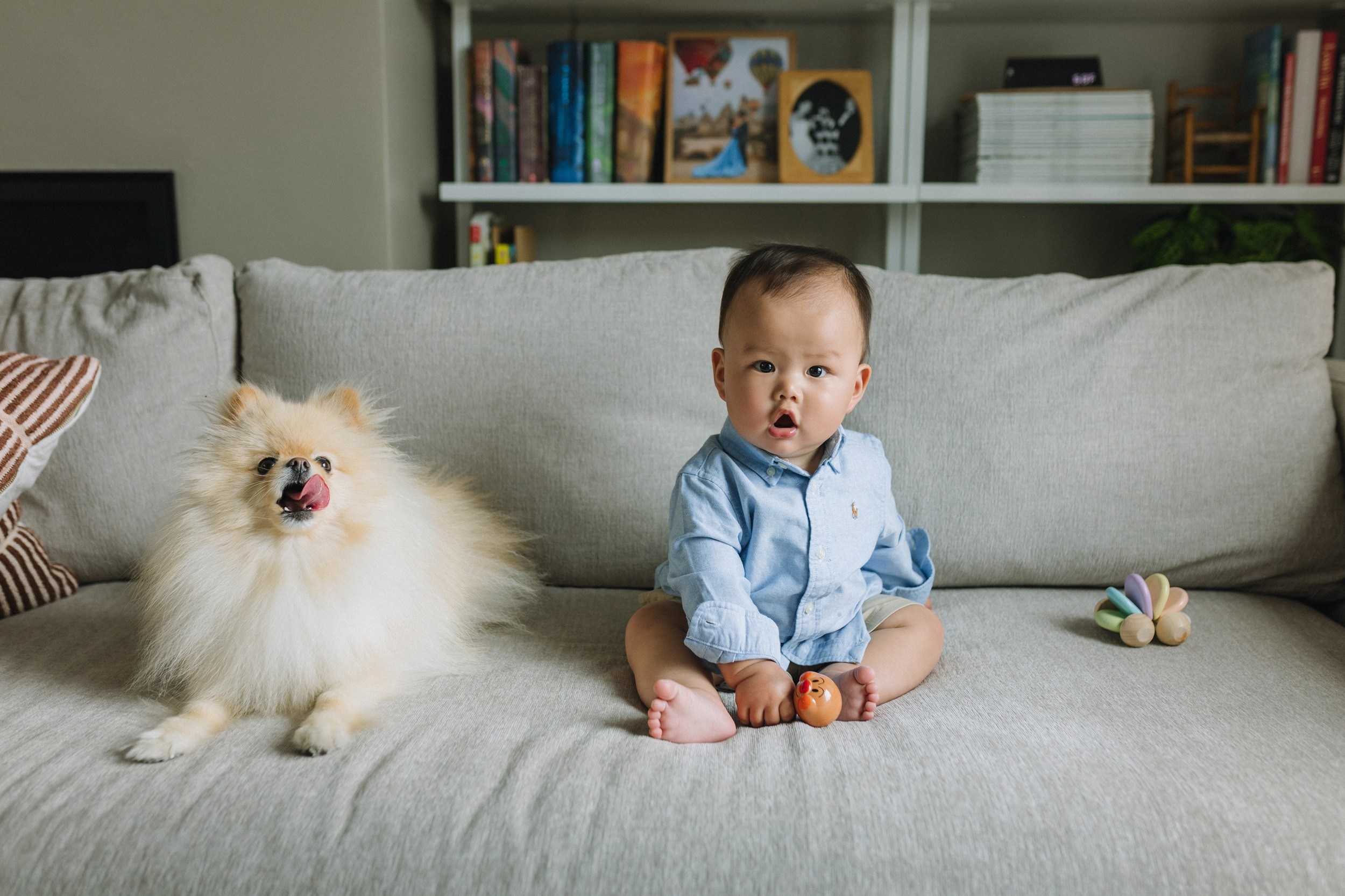 8-month-old baby smiling during an at-home family photography session in the Bay Area
