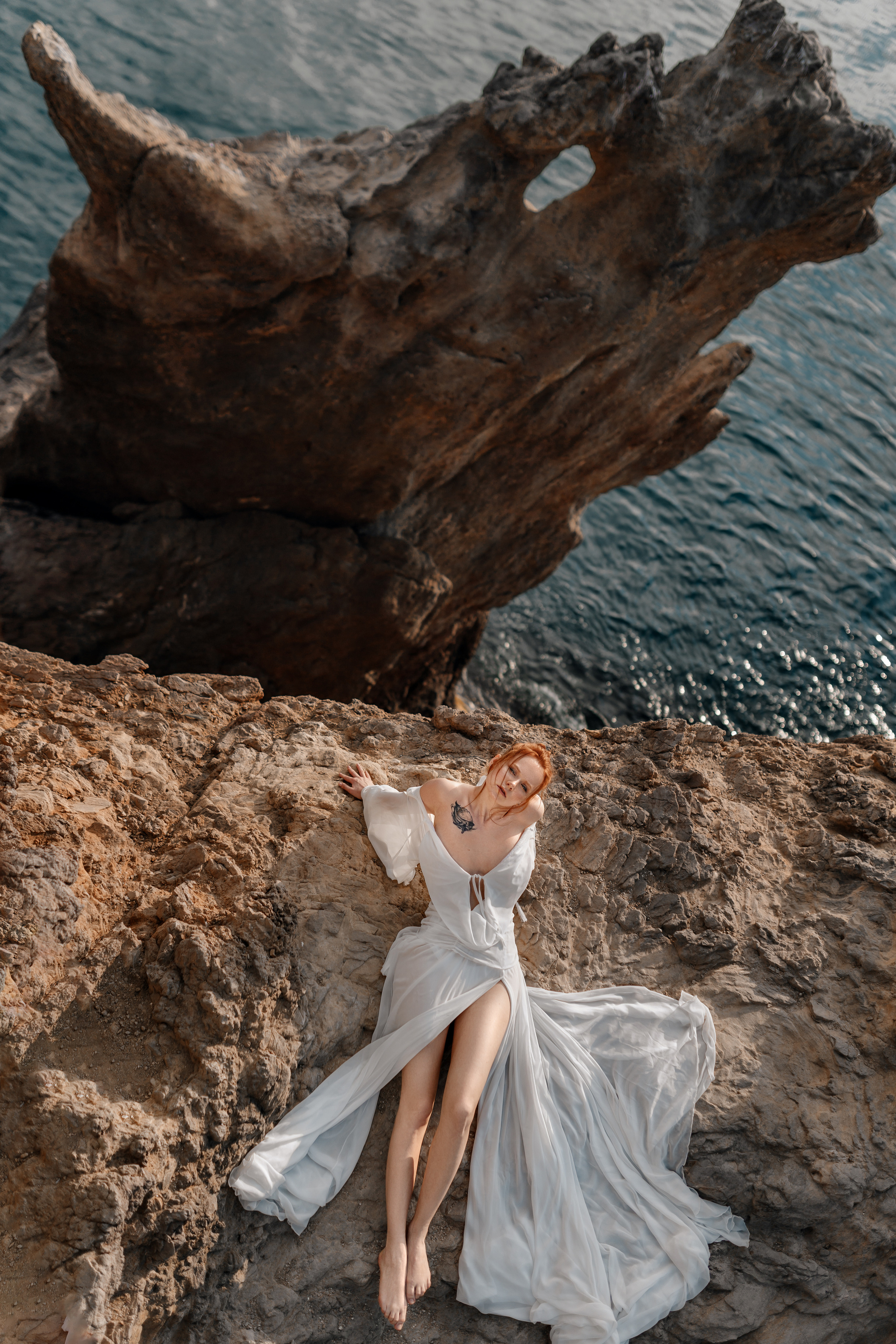 Phtooshooting at the rocky sea coast. Professional Photographer in Miami, Florida