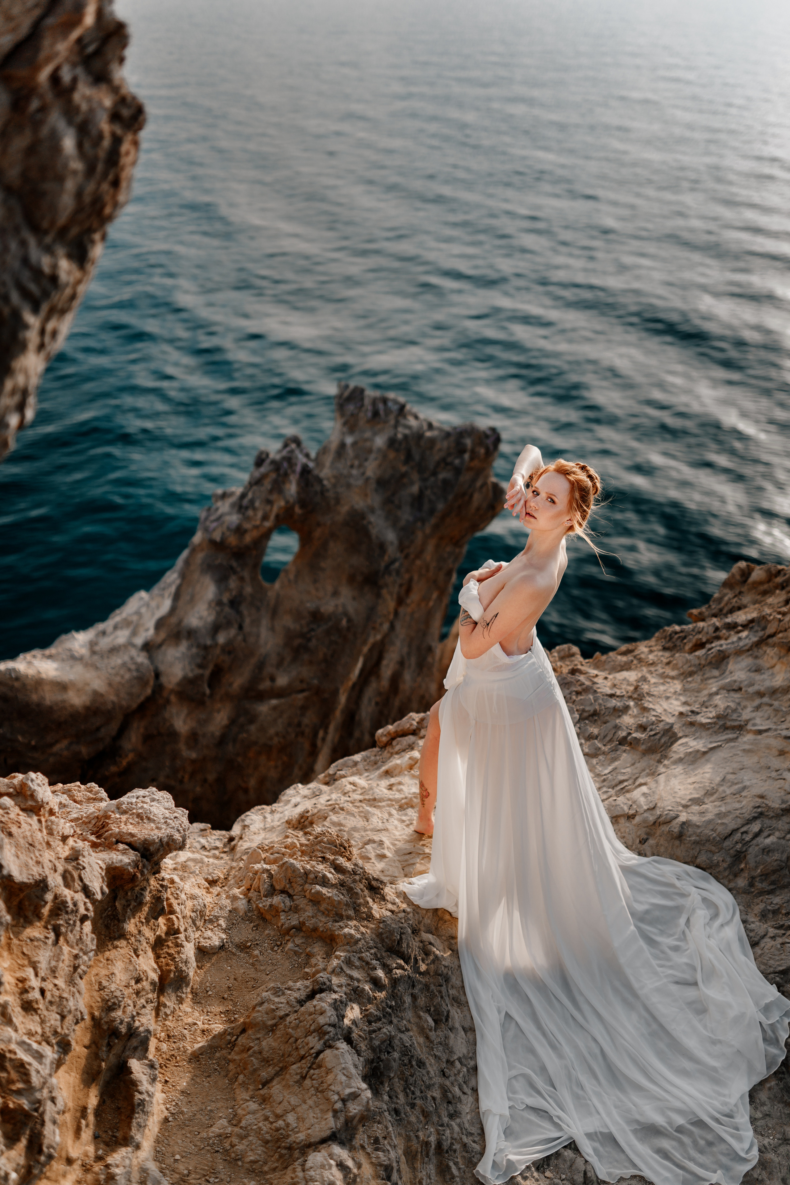 Phtooshooting at the rocky sea coast. Professional Photographer in Miami, Florida