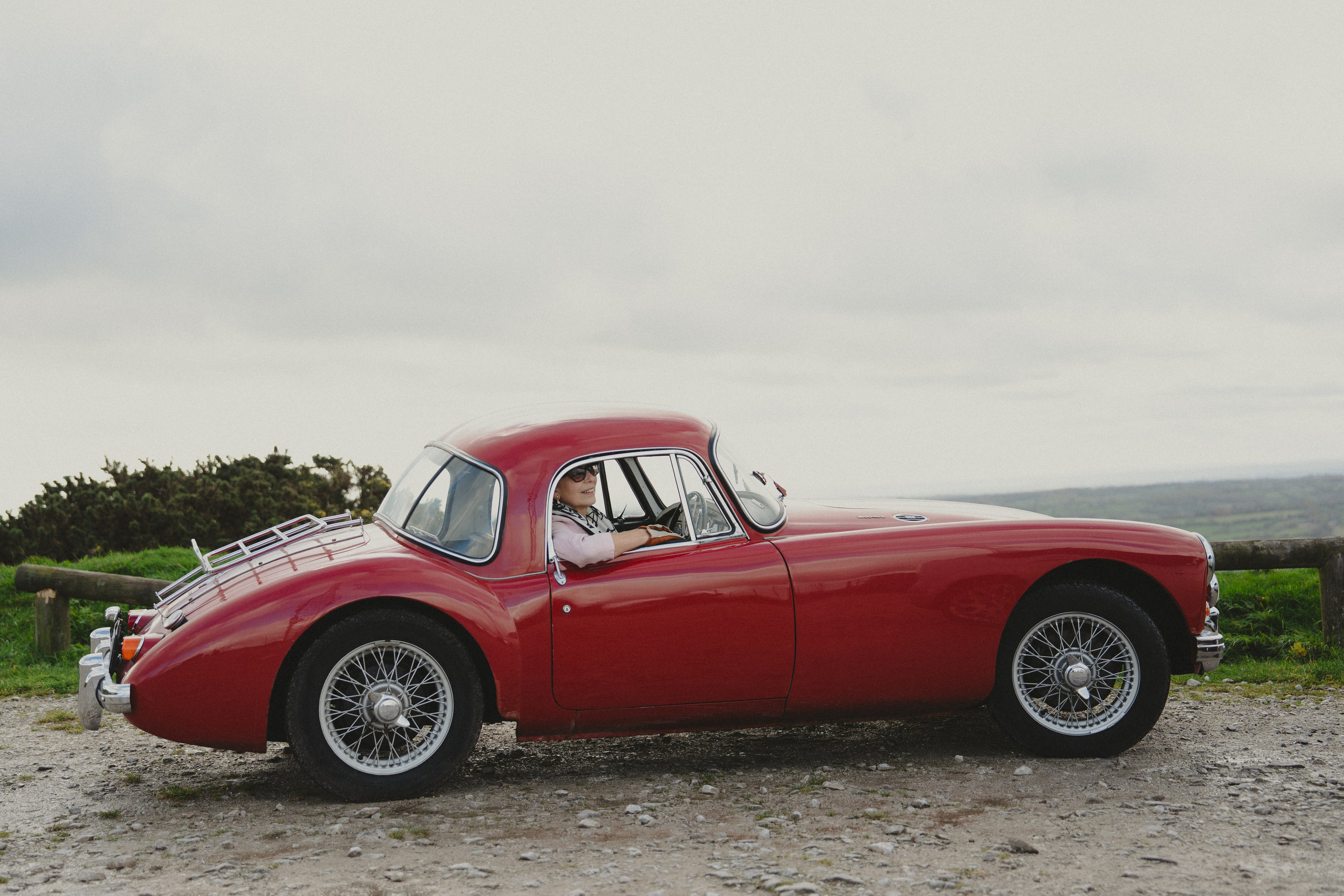 Lifestyle portrait with a classic red sports car in Derbyshire