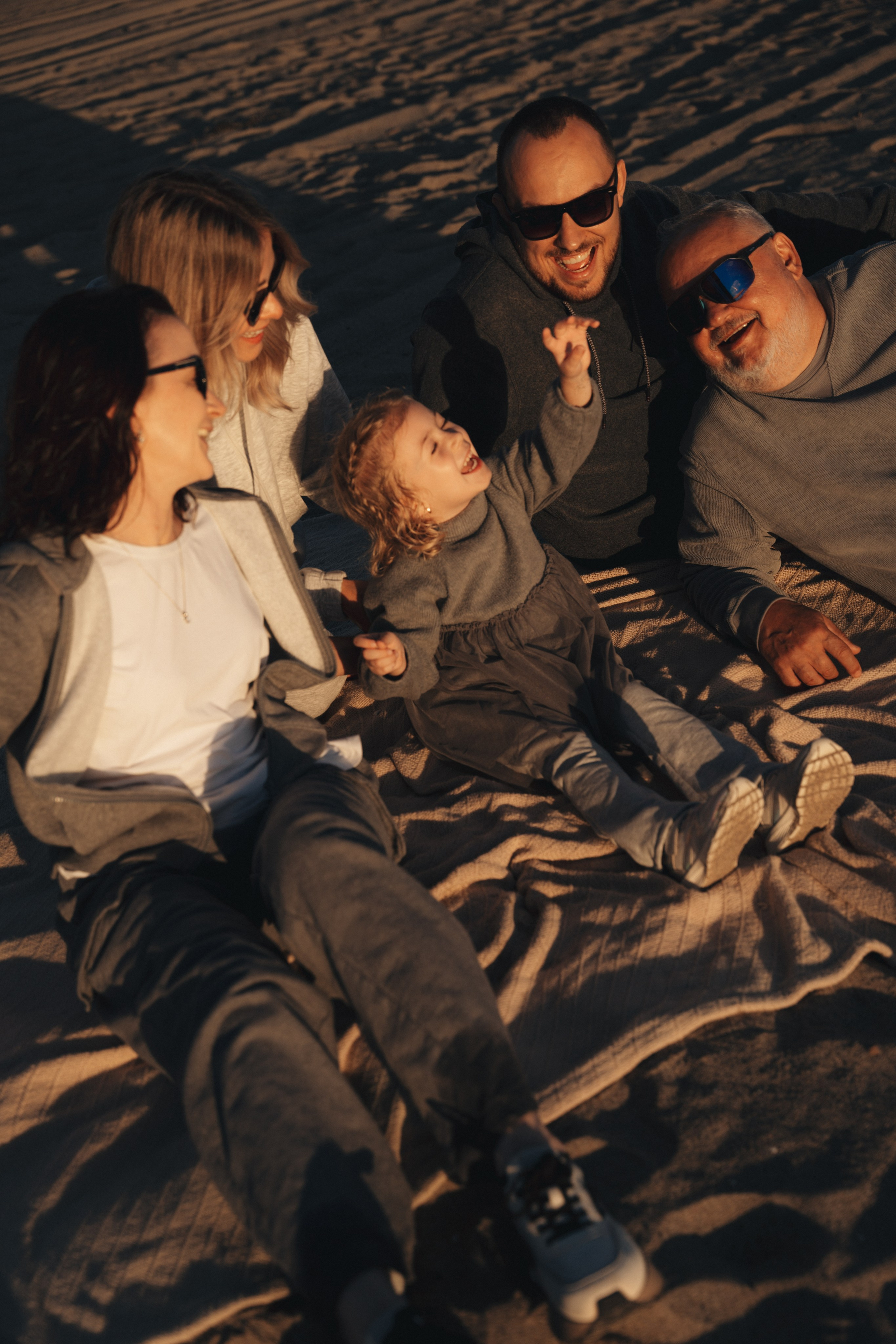 Family photoshoot. Family photoshoot outside. Beach photoshoot. Family holiday photoshoot. Sunset photoshoot