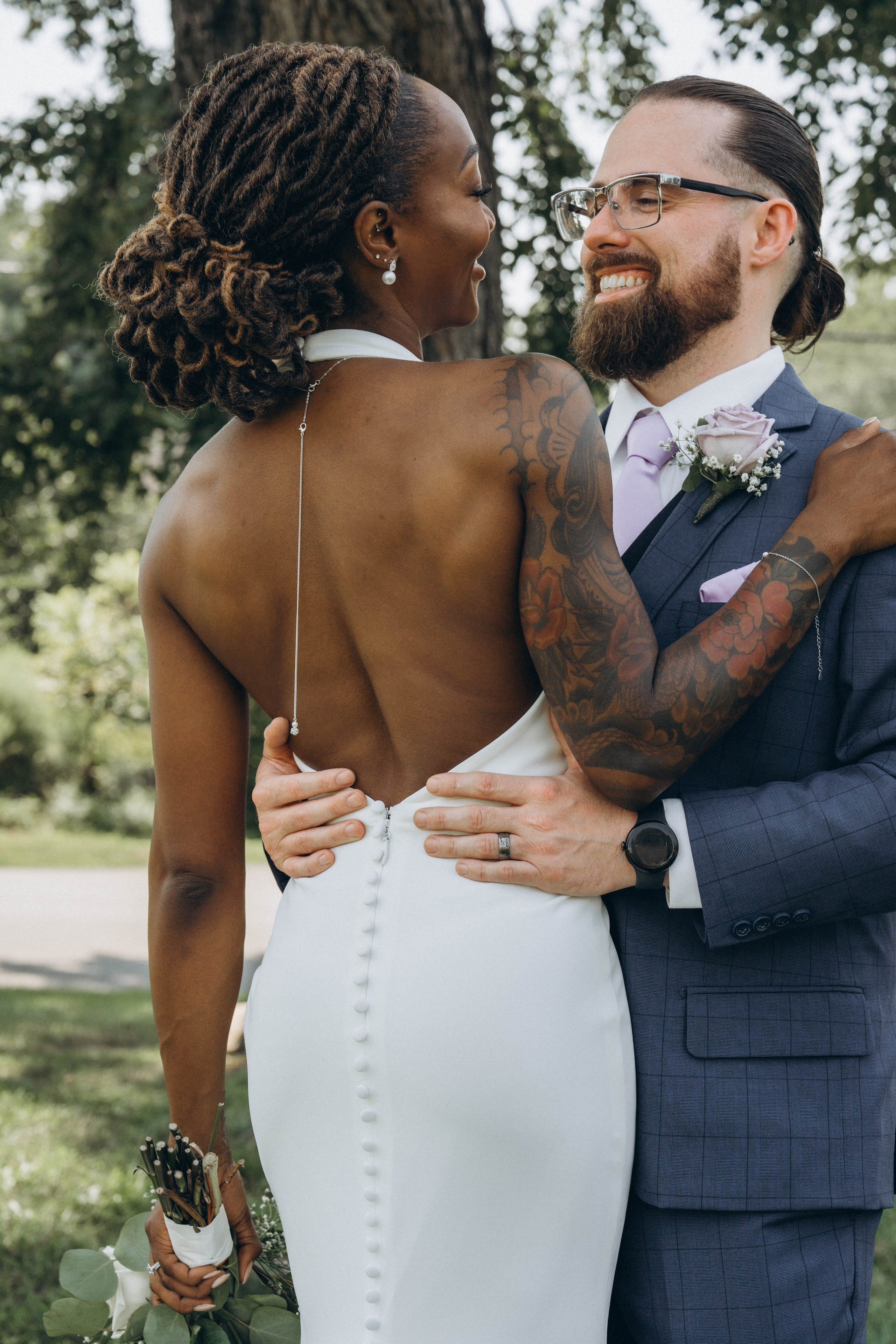 Candid bride surprising groom during intimate first look
