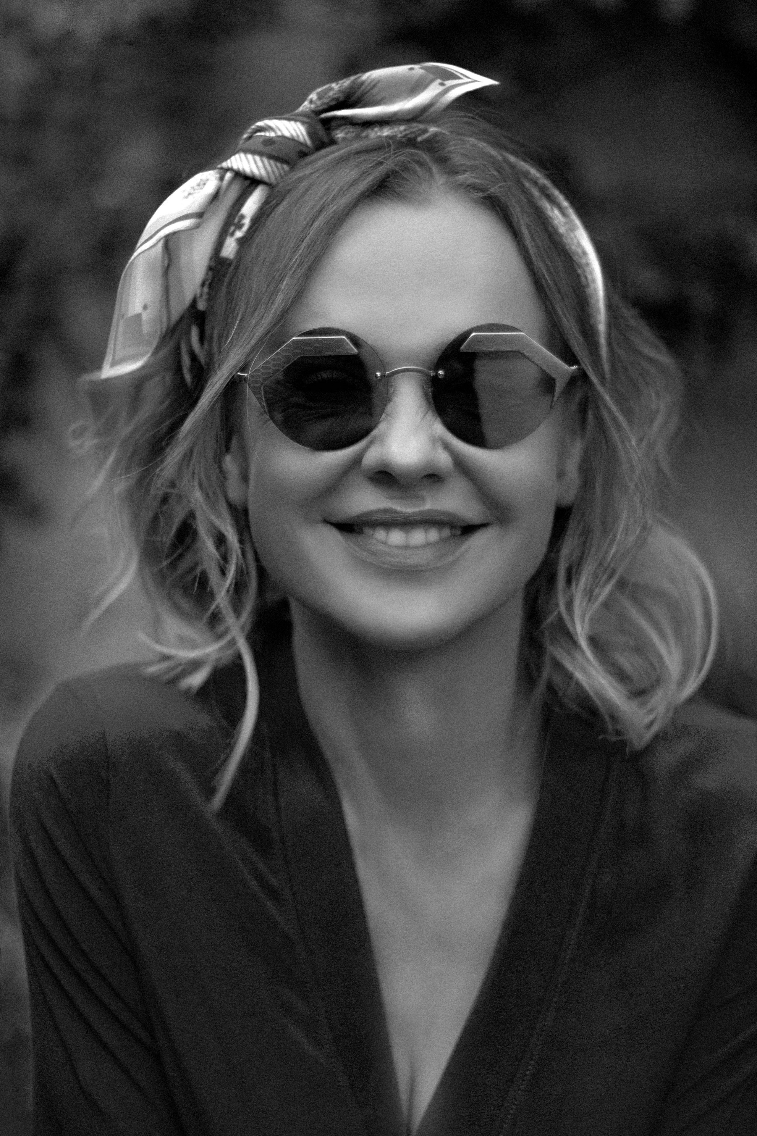 Portrait of a woman in a garden. Portrait and still life photographer. Designer, photographer, and illustrator