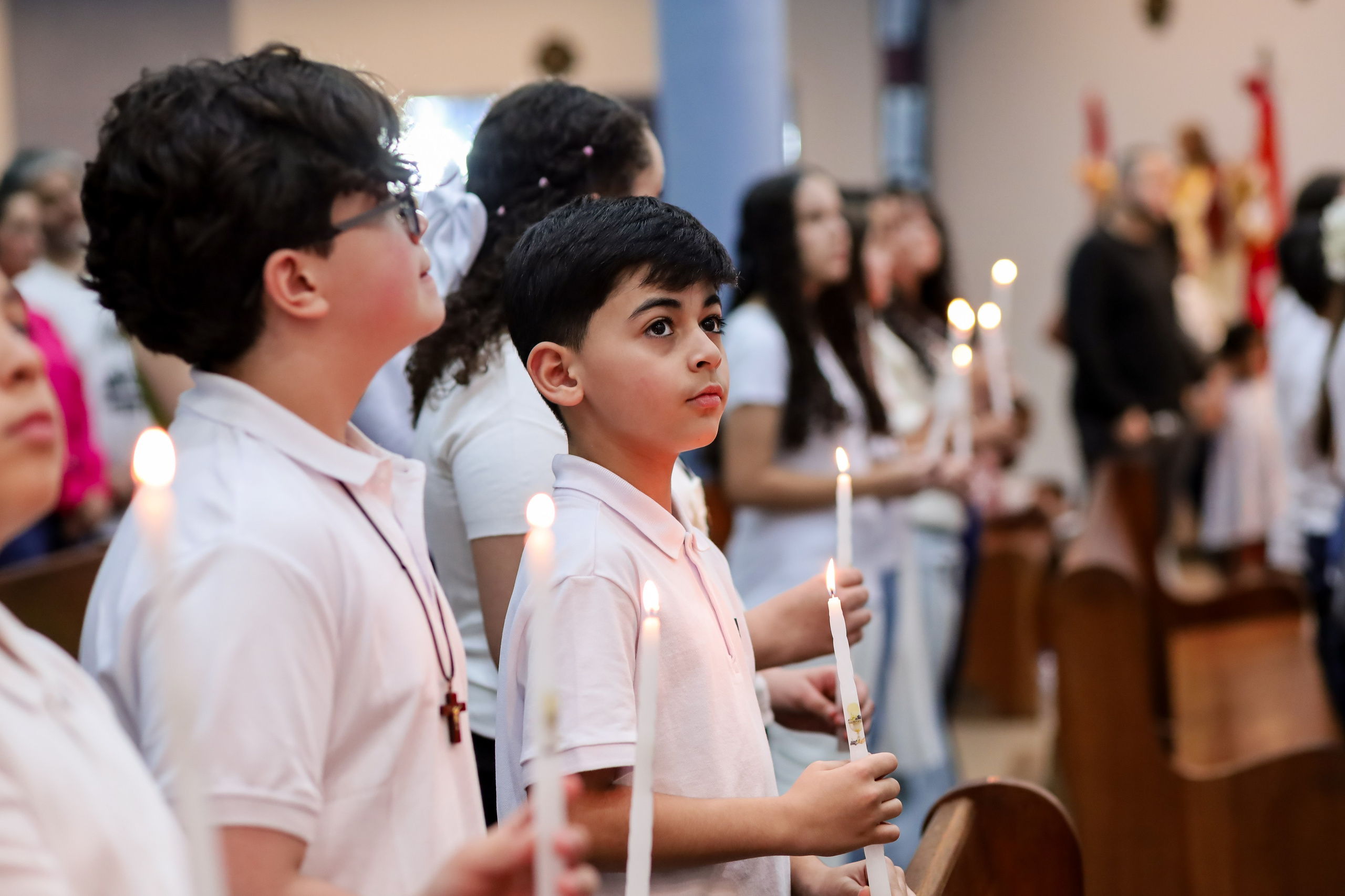 Primeira Eucaristia. Fotógrafo de momentos Sagrados