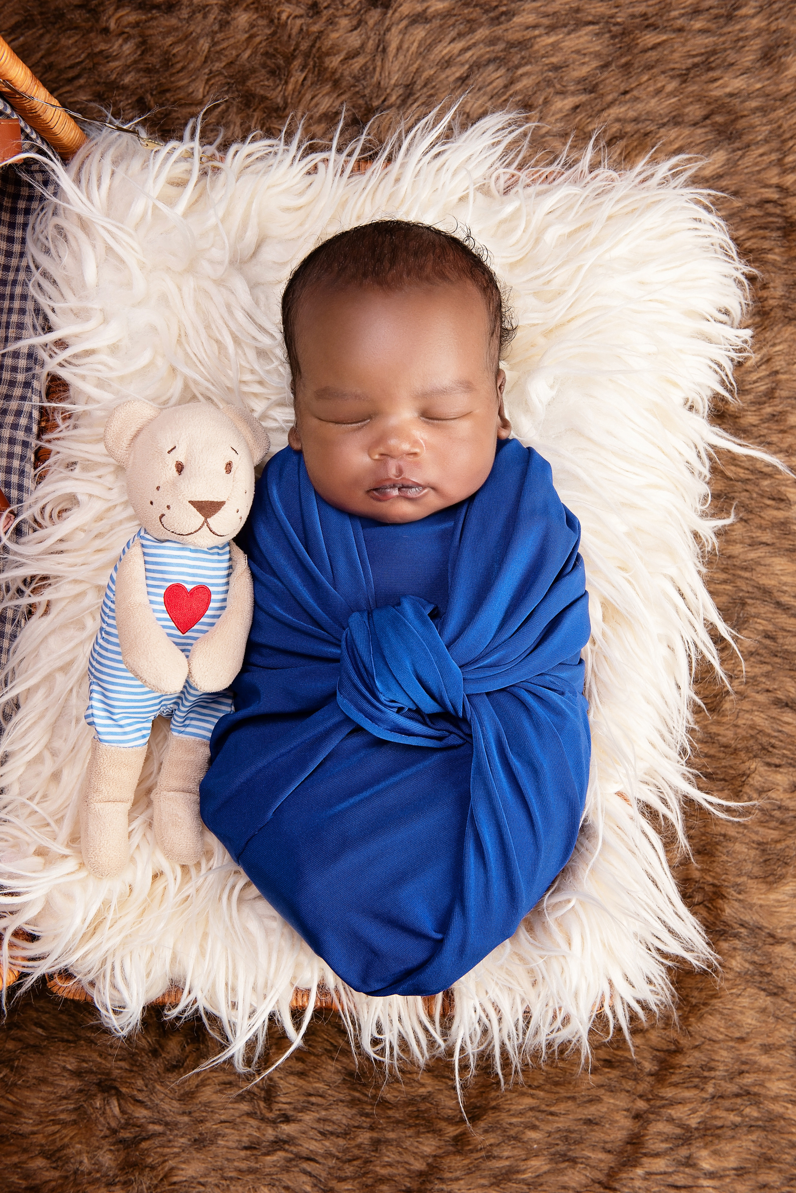 Black Kenyan baby boy wrapped newborn photo shoot Kisumu Eldoret Kenya