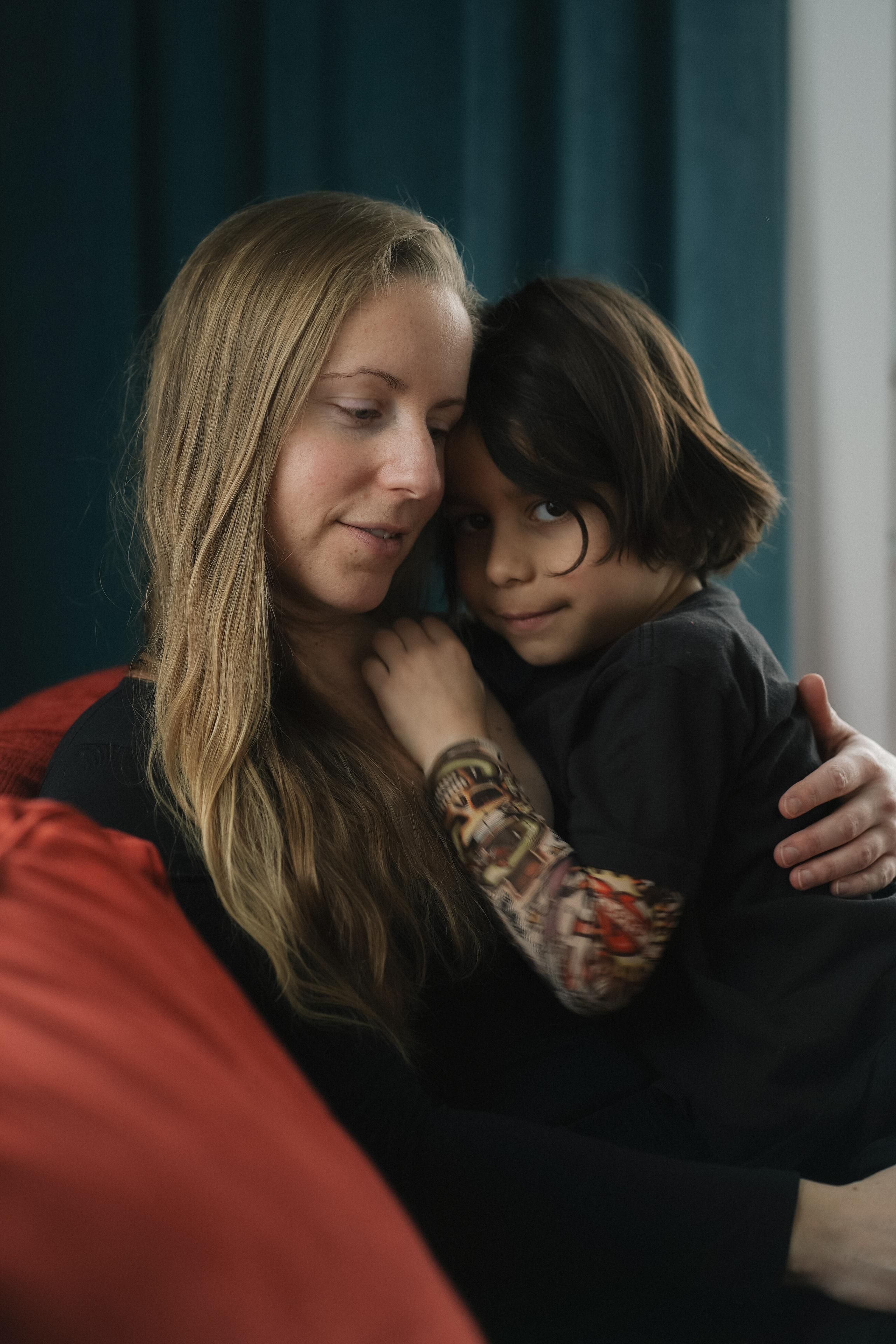 Family photography Burnaby, Warm embrace of mother and her son, projecting peace and comfort