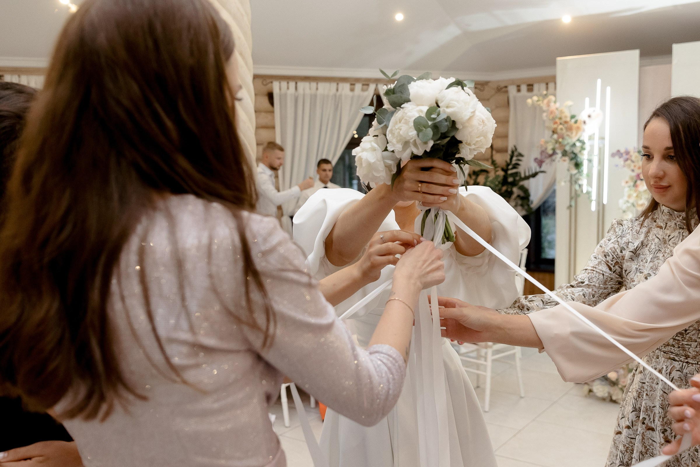 Bride bouquet toss close up, by Bude, Cornwall wedding photographer.