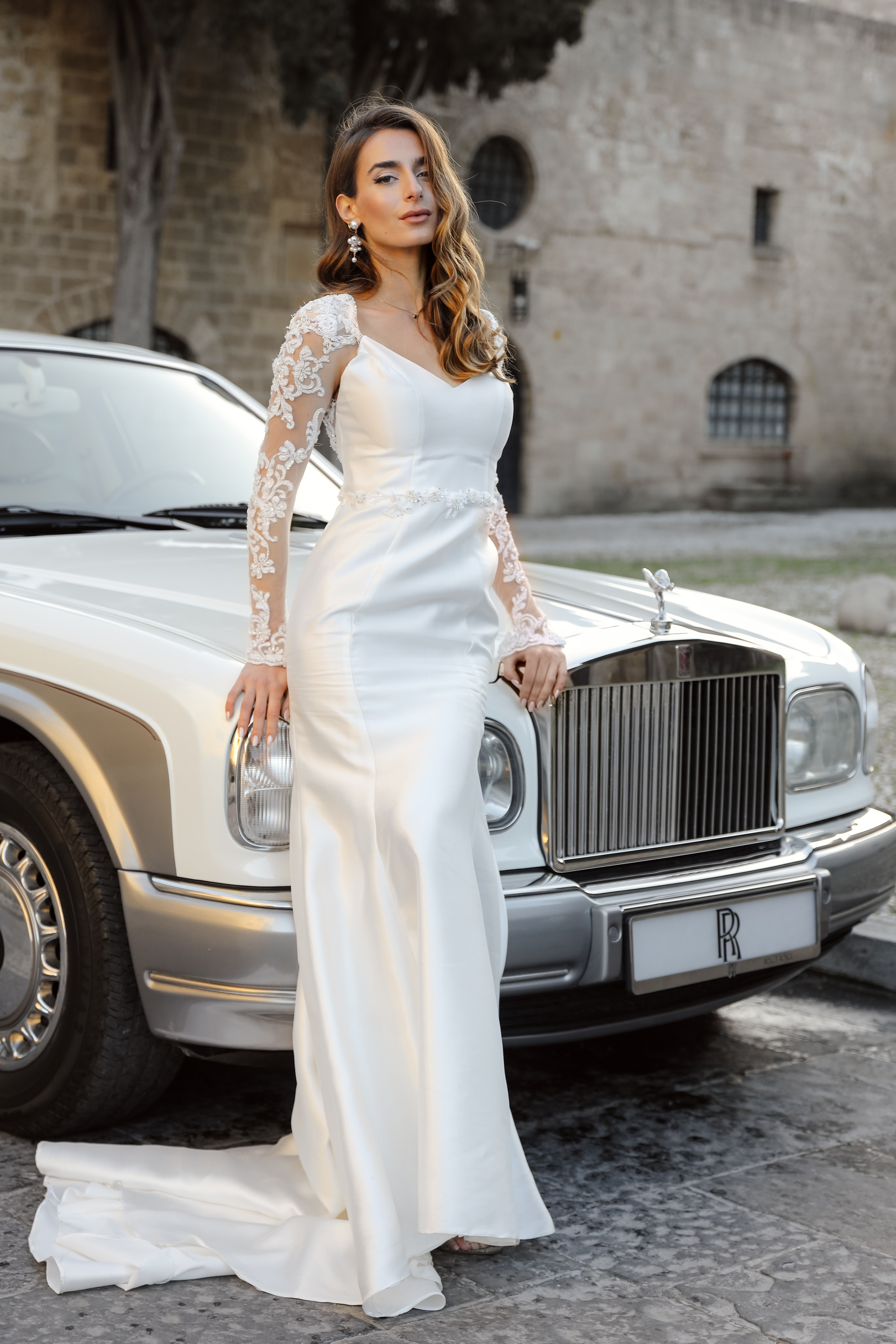 A bride next to Rolls Royce in old town of Rhodes island, Greece
