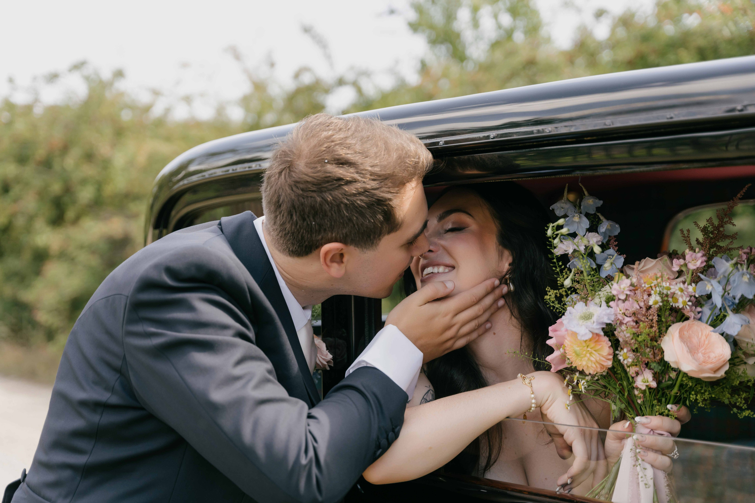     couple in car romantic candid wedding moment UK