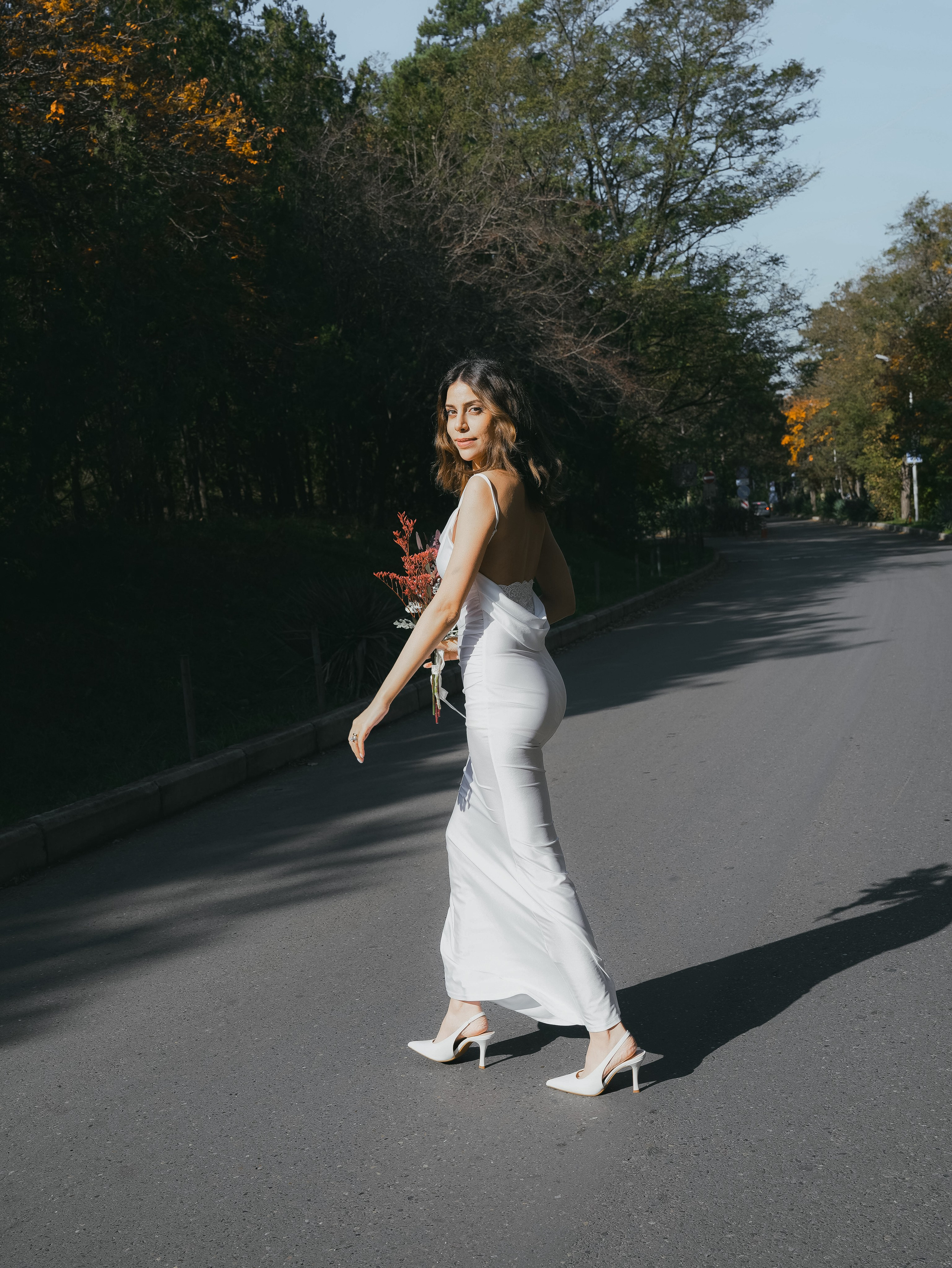 Beautiful bride walking at Lisi Lake location, Tbilisi