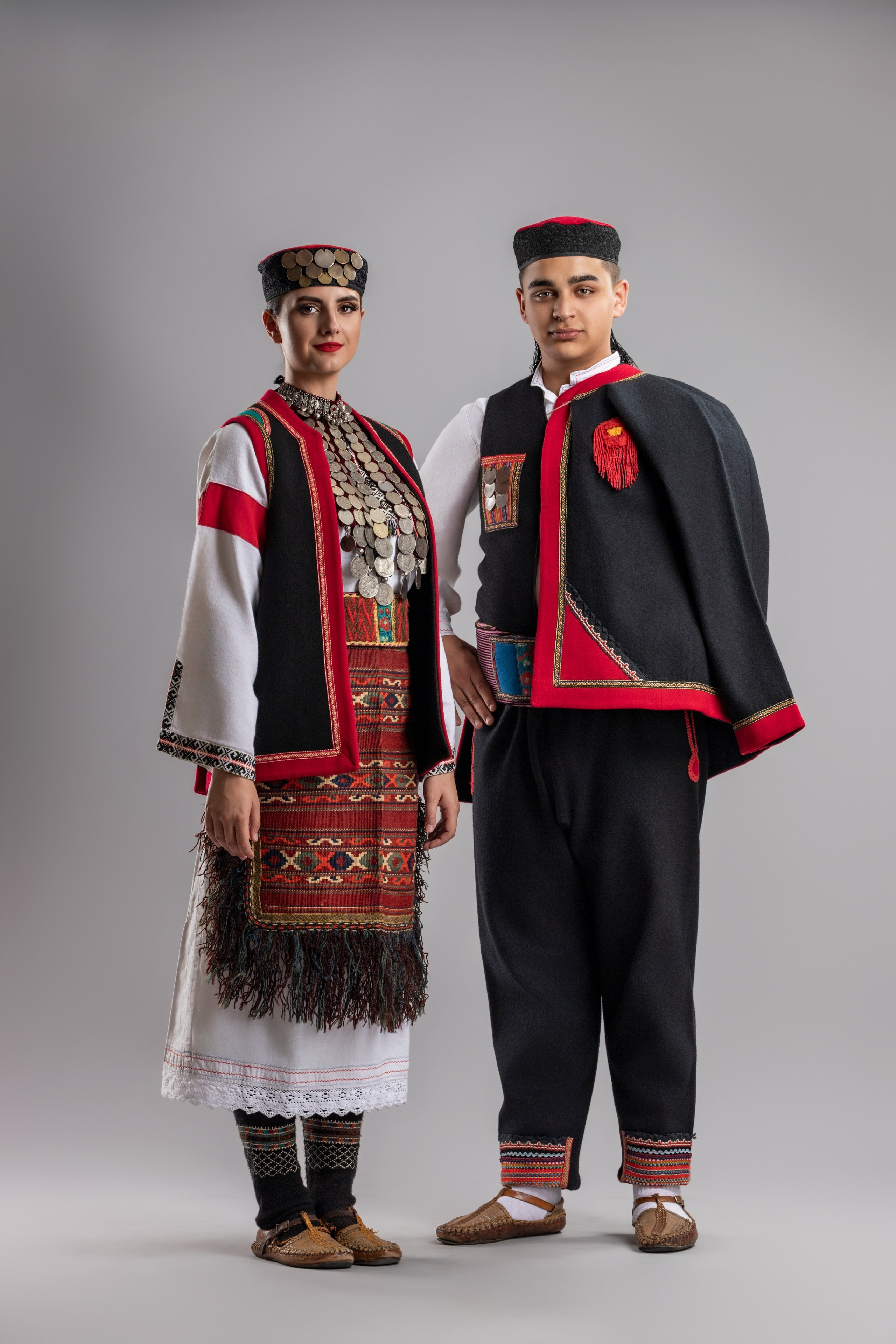 Studio portrait photography of traditional folk costumes from Bosnia and Herzegovina featuring authentic cultural clothing, embroidery, jewelry and handcrafted garments, photographed by Namir Čomaga. The images highlight the richness, craftsmanship and cultural heritage of Bosnian traditional costumes through carefully lit studio portraits.