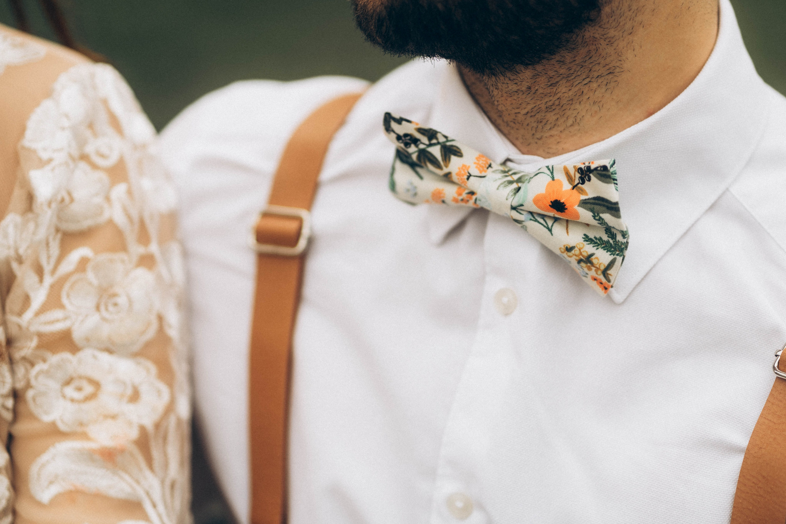 Stylish detail shot of bride and groom