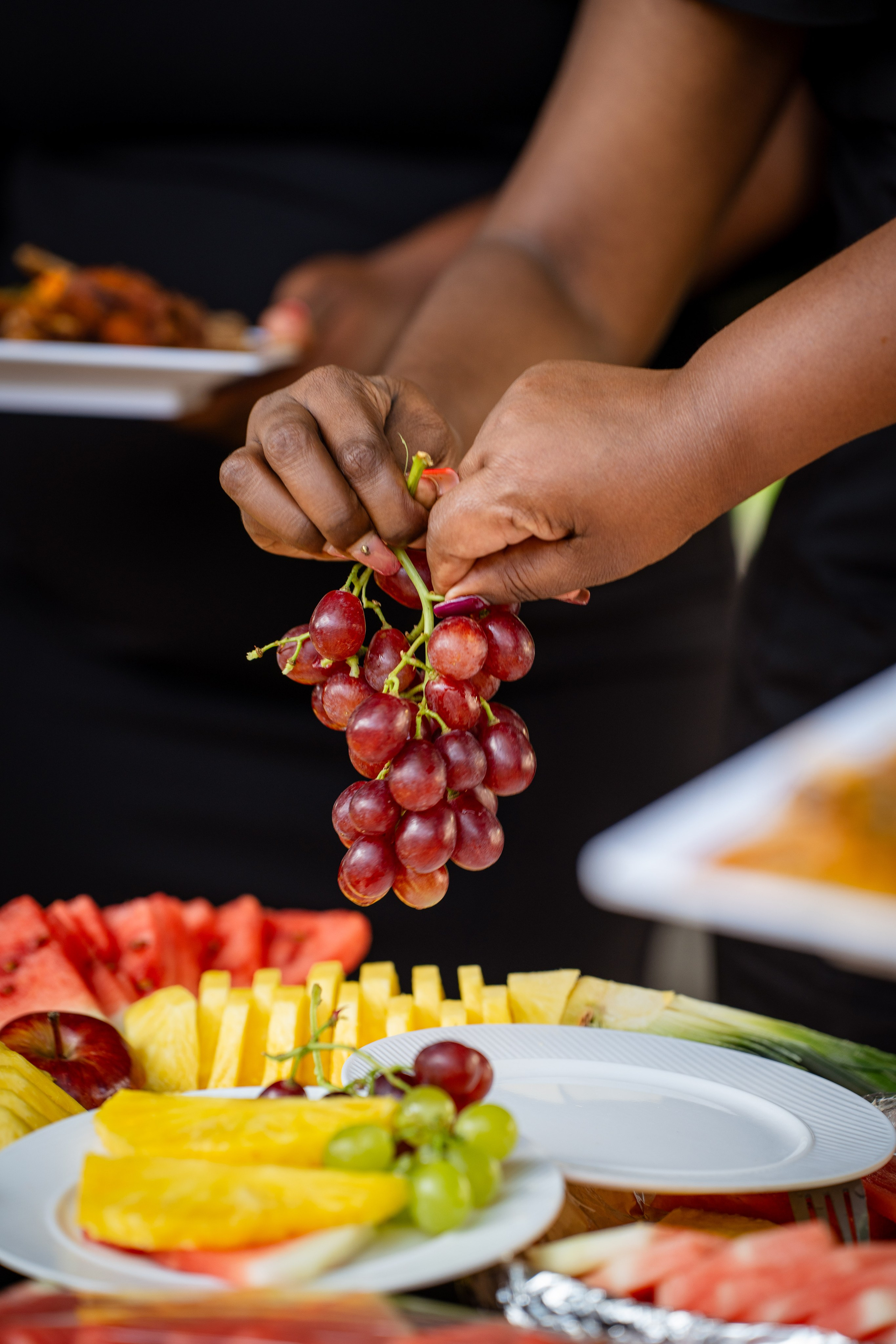 Close-up of two hands holding fresh berries – Kenyan food styling photography