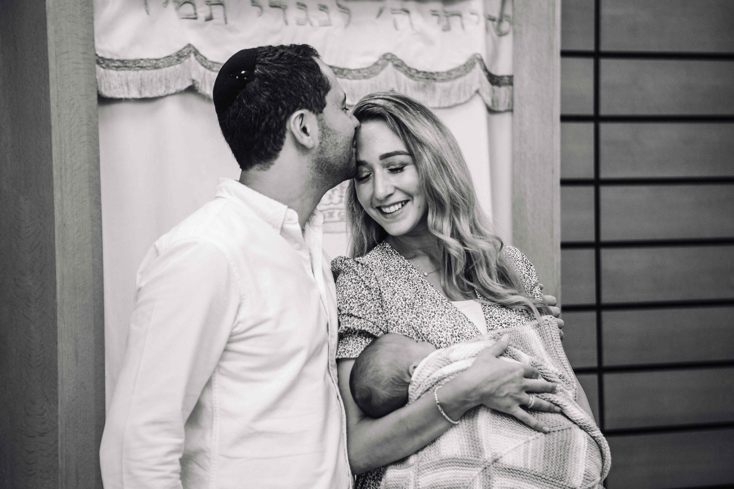 BRITH MILA IN THE SMALL SYNAGOGUE. PHOTOGRAPHER IN ISRAEL