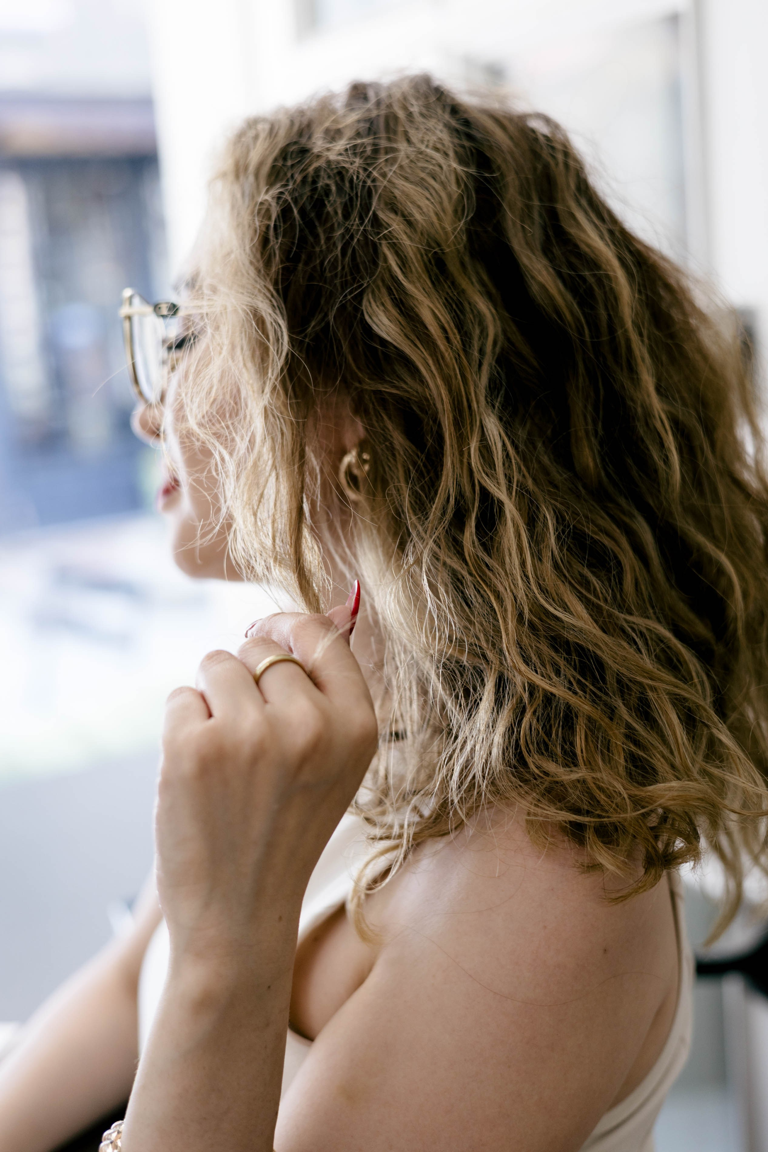 Close-up portrait of a woman by the window