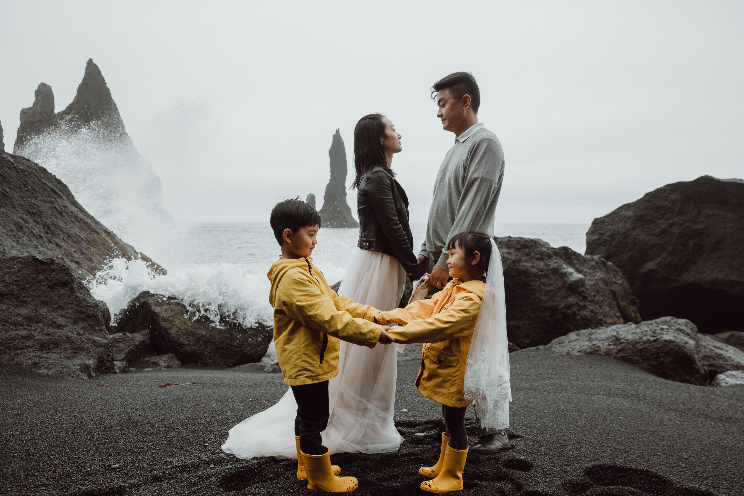 Family photoshoot at black sand beach in Iceland. Iceland elopement photographer & videographer
