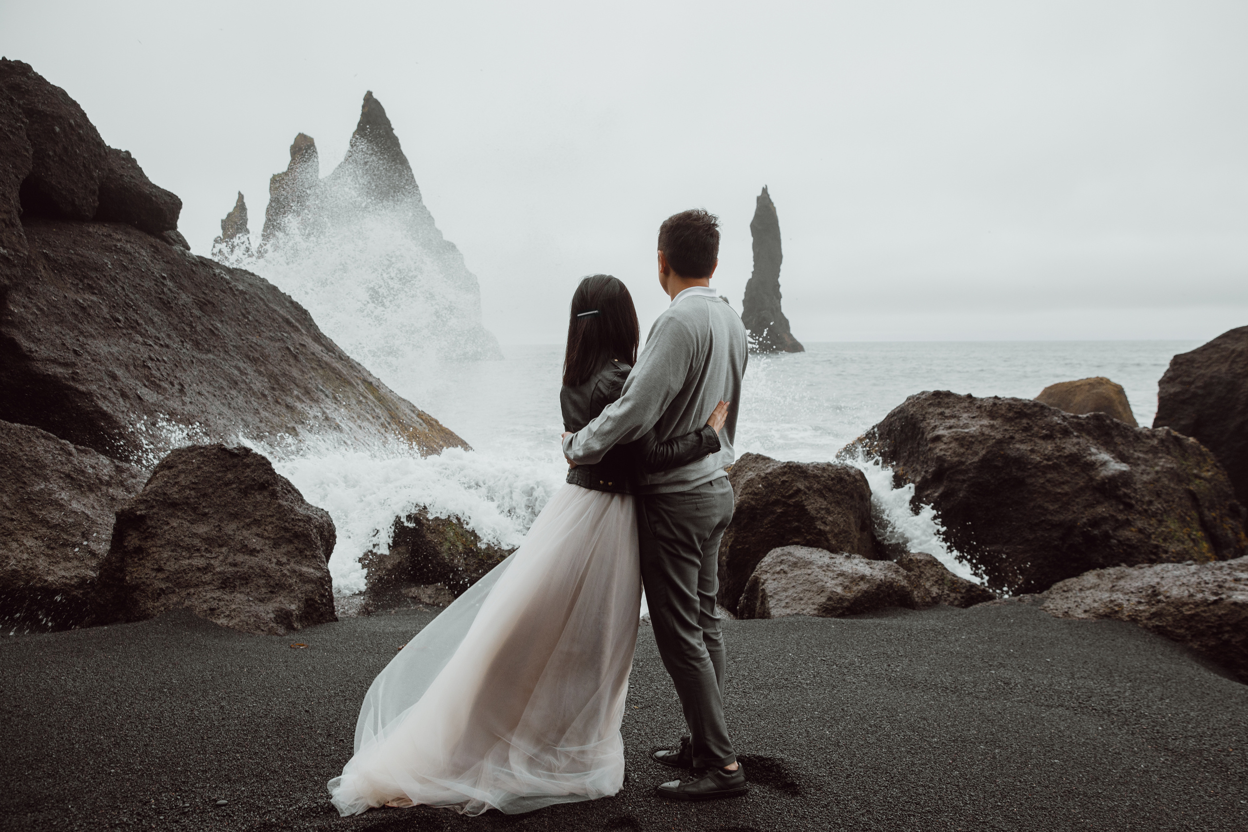 Family photoshoot at black sand beach in Iceland. Iceland elopement photographer & videographer