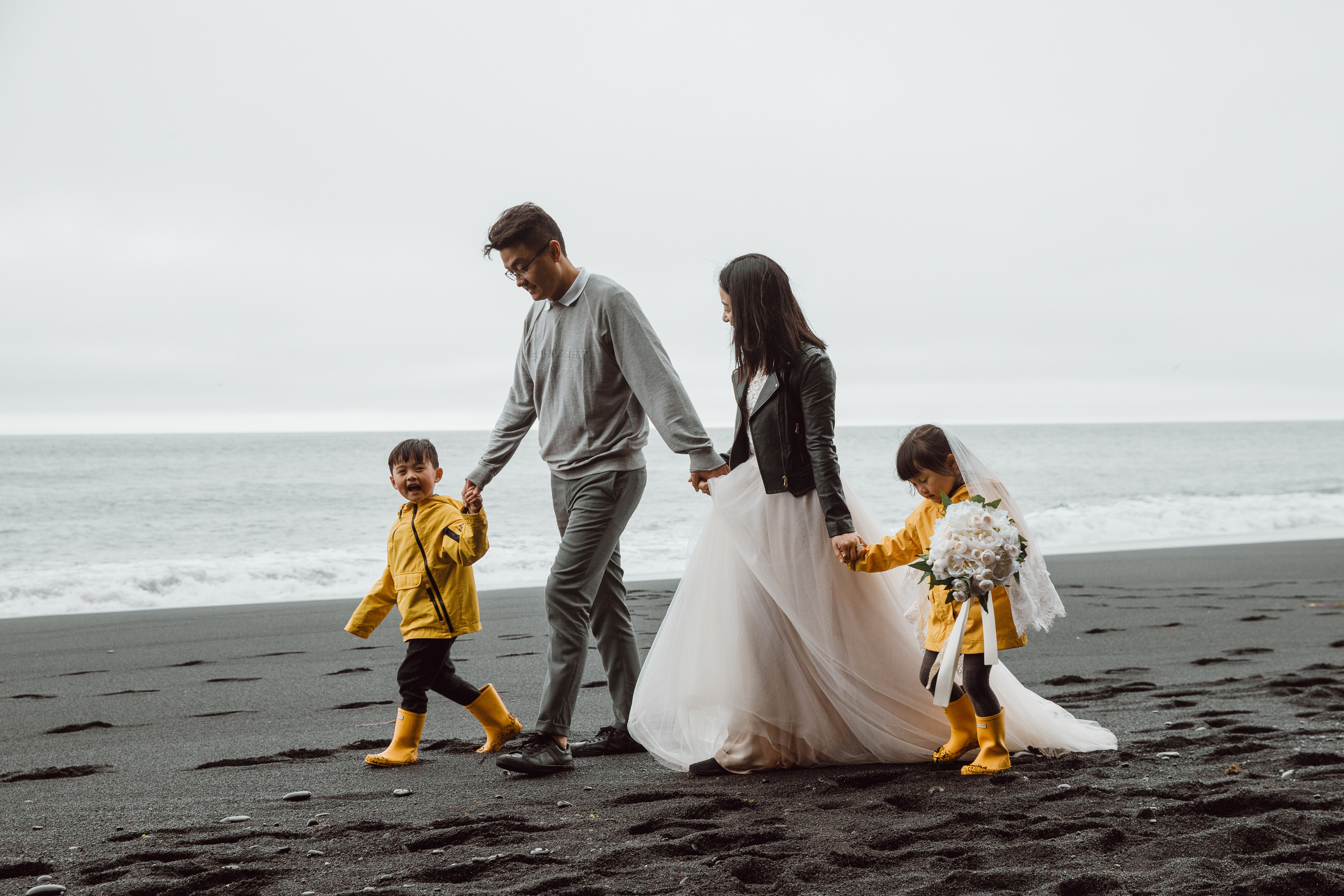 Family photoshoot at black sand beach in Iceland. Iceland elopement photographer & videographer
