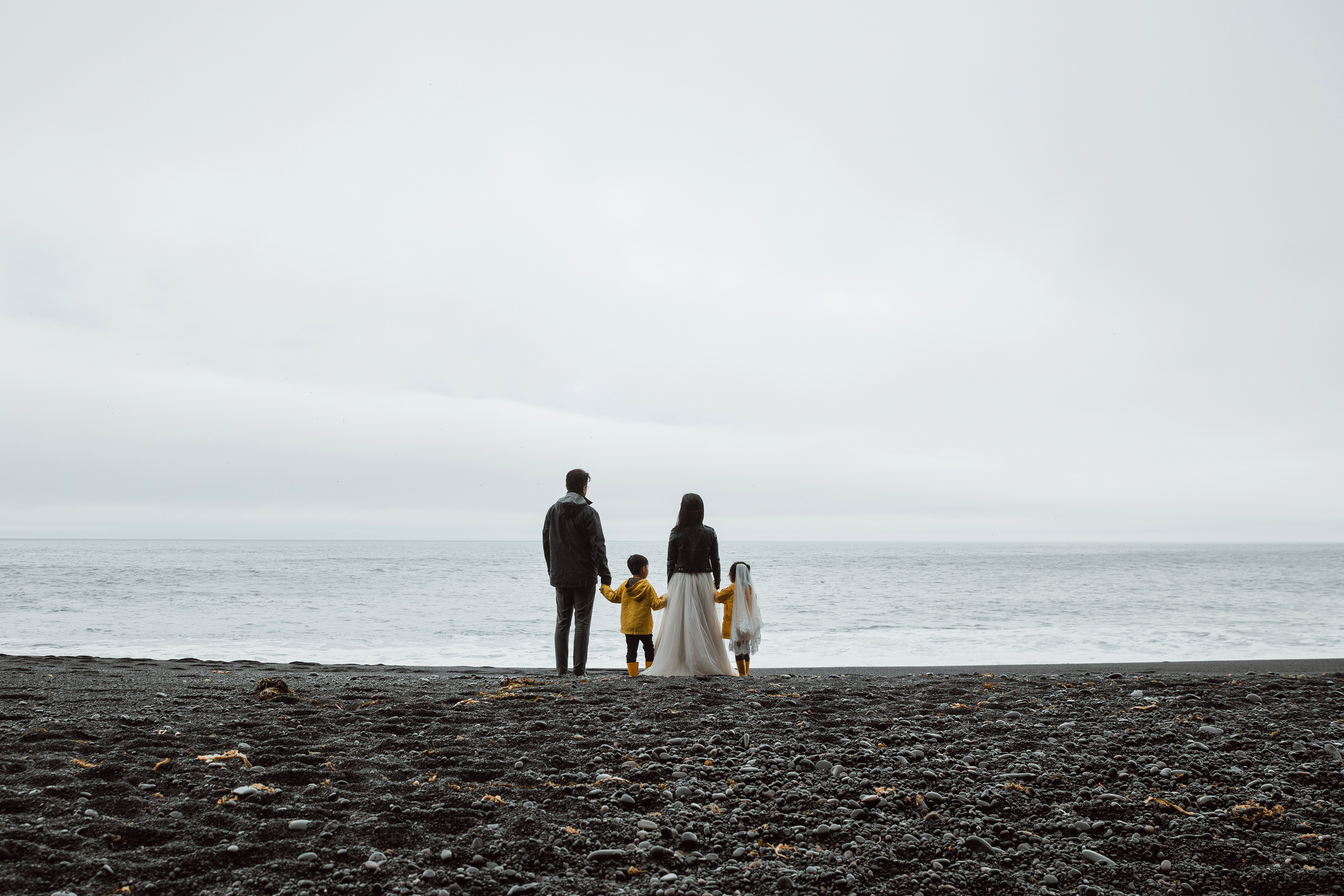 Family photoshoot at black sand beach in Iceland. Iceland elopement photographer & videographer