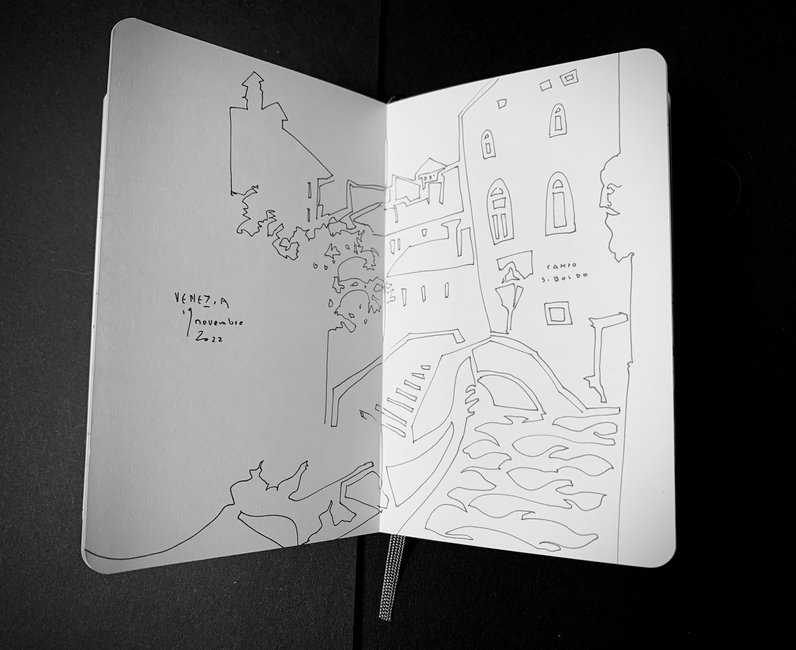 Moleskine notebook with original drawings made in Venice, research on paper for an editorial project by an artist who lives and works in Venice. A linear black and white drawing of Campo San Boldo.