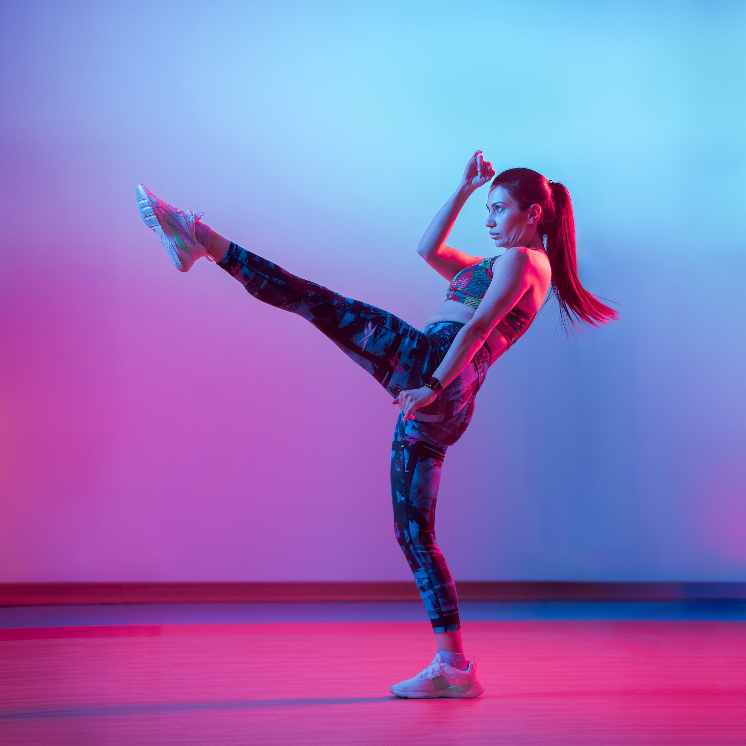 Female fitness dancer under bright lights