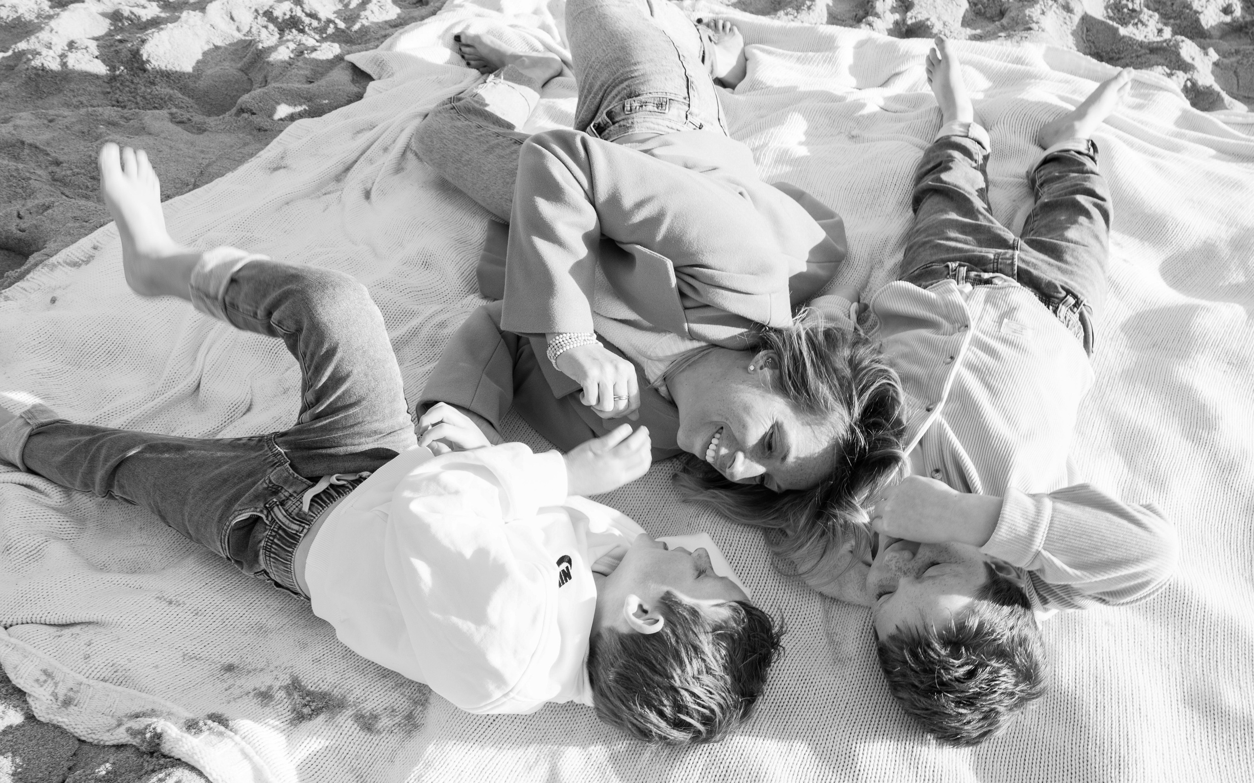 Sun, Sand, and Family Hugs. Family, lifestyle, and commercial photography in New York and New Jersey