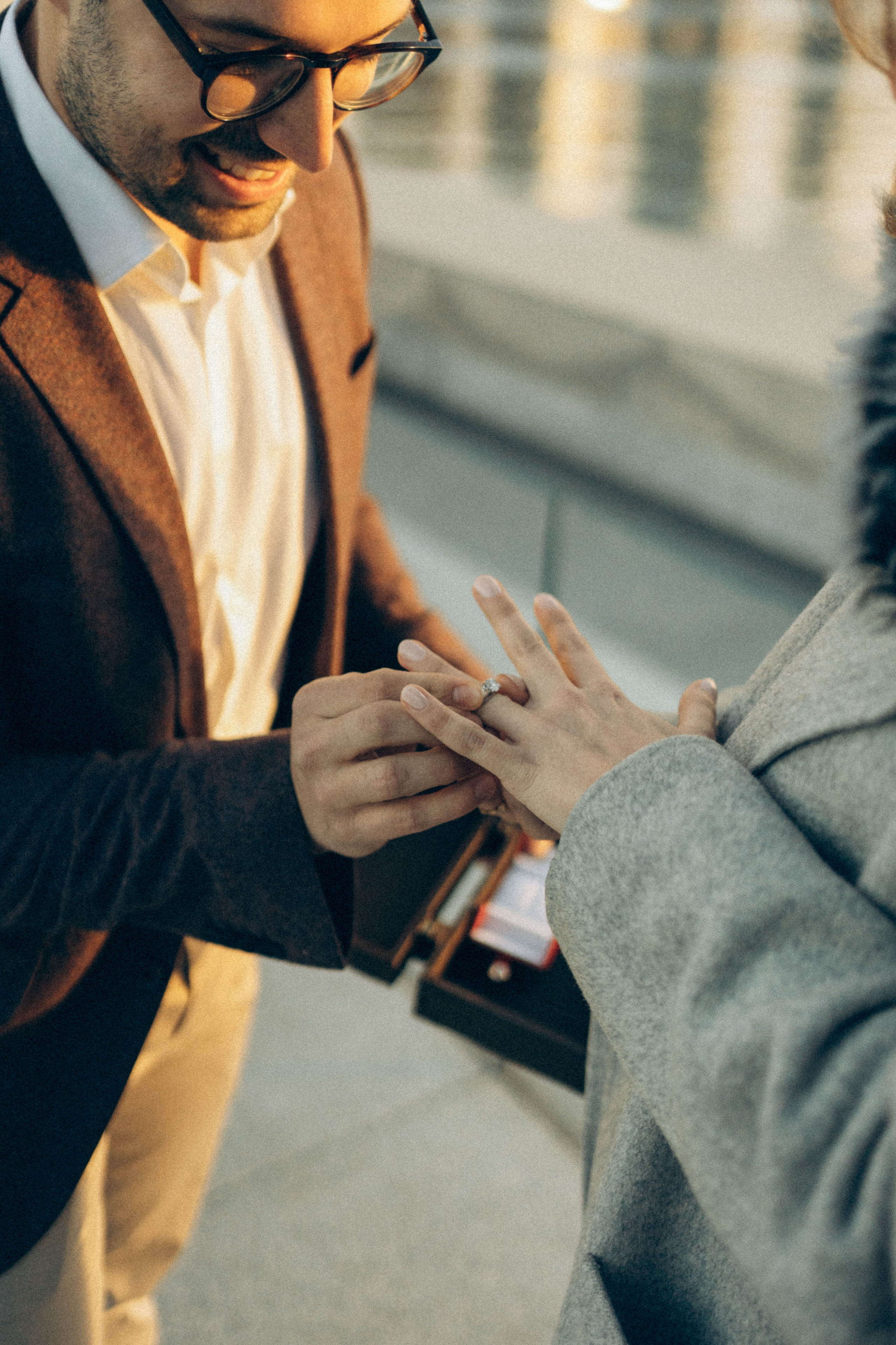 Surprise proposal at Bethesda Fountain summer afternoon.