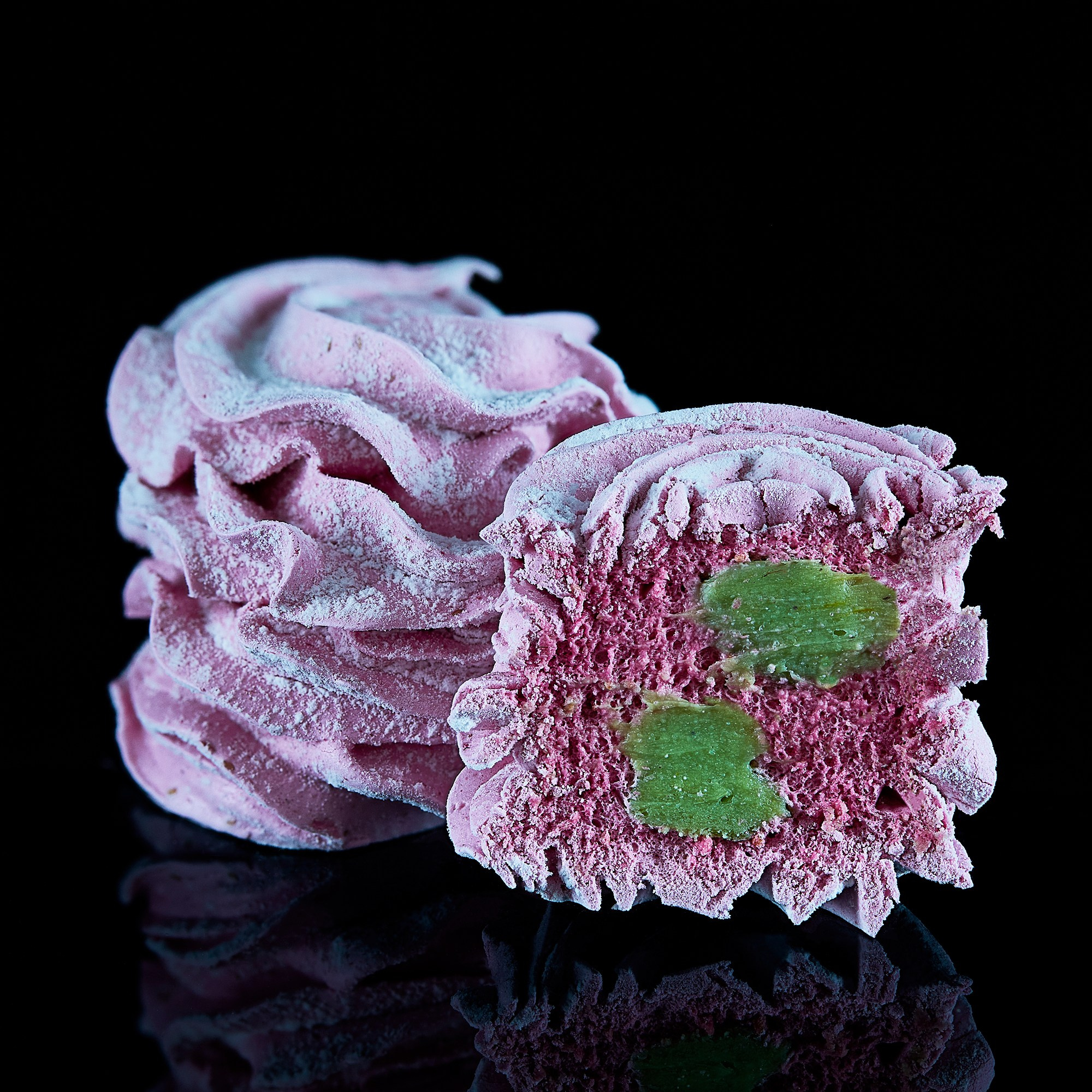 Photographer Roman Djuzev - Sliced ​​Marshmallow on Black Background with Reflection.