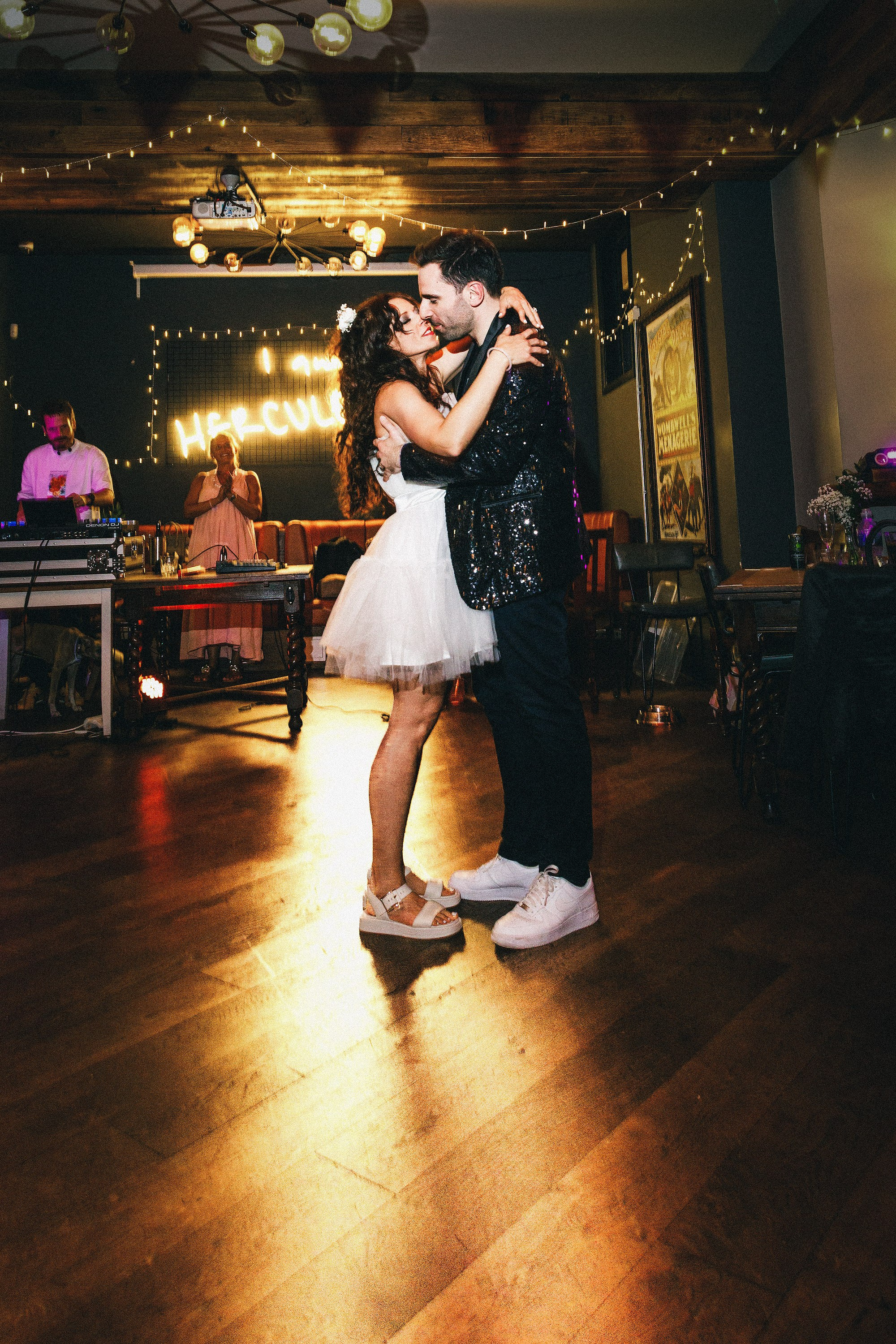 Newlyweds embracing on the dance floor at their pub wedding