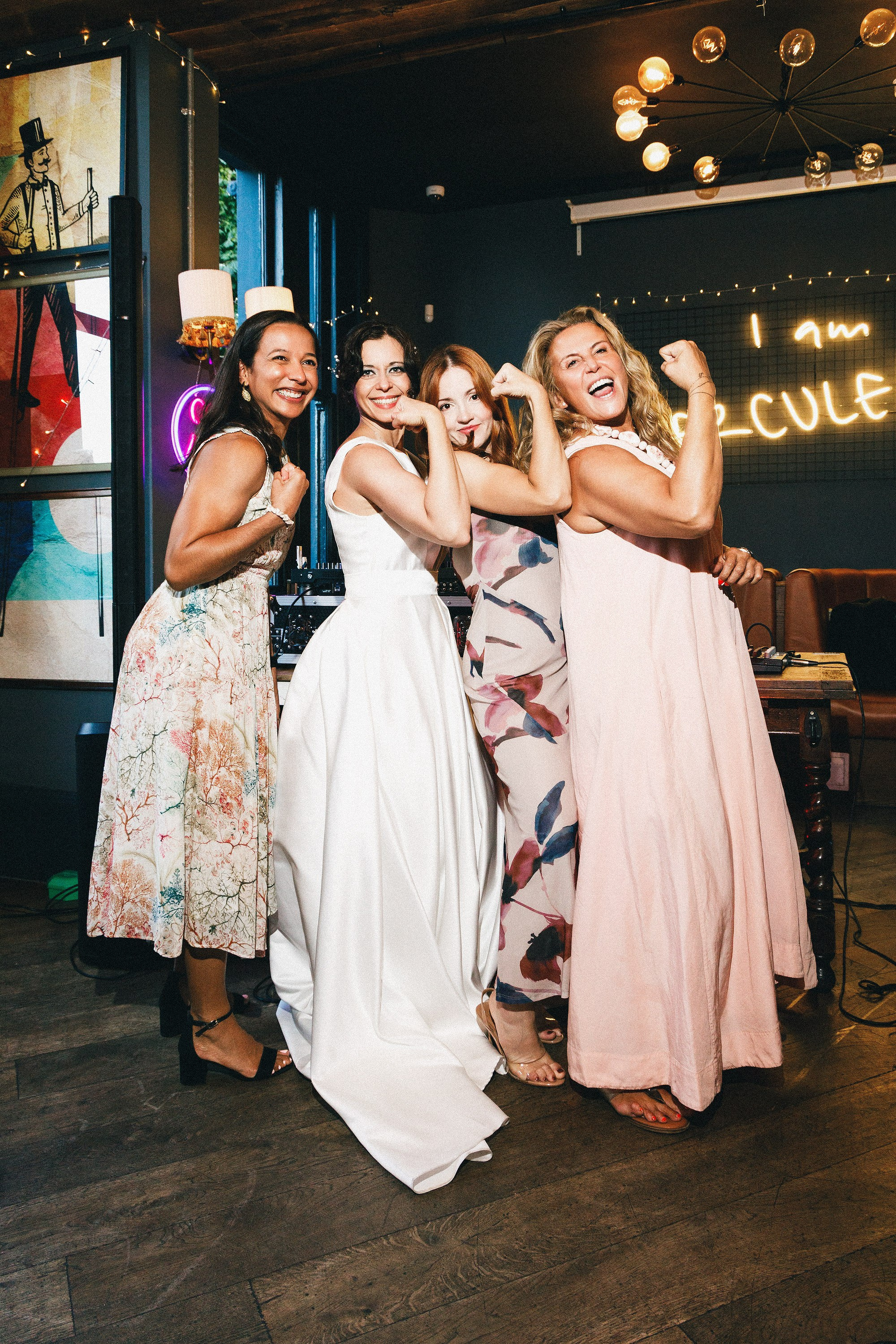 Bride celebrating with friends at The Hercules wedding reception