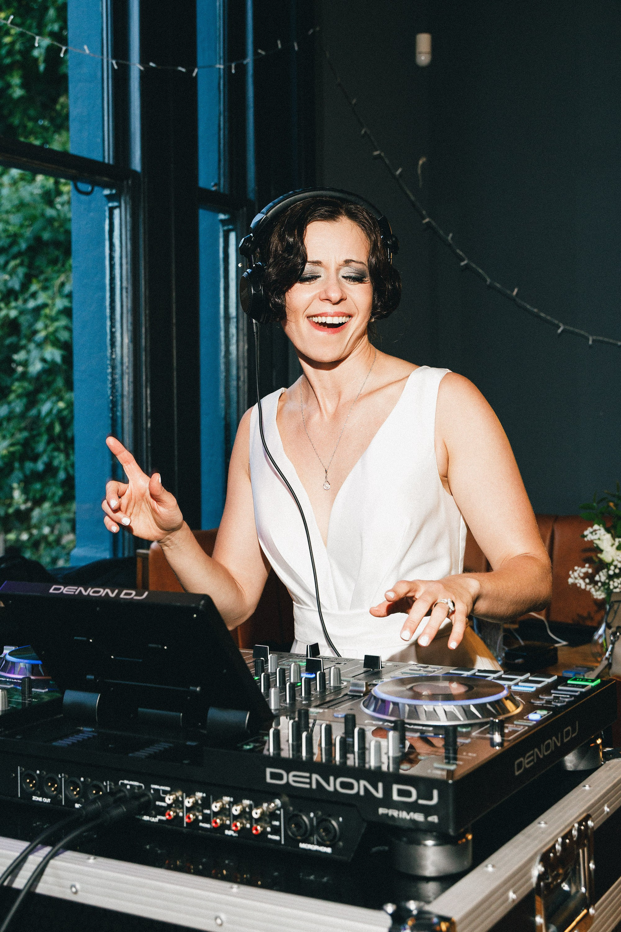 Bride DJing at a small London pub wedding reception