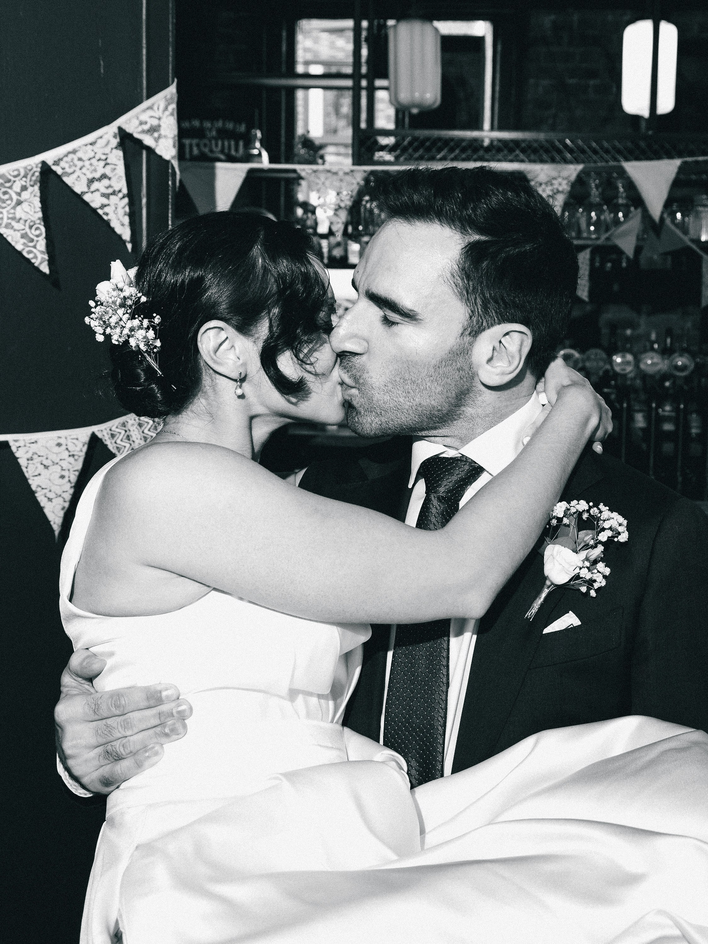 Newlyweds sharing a kiss at The Hercules in Lambeth, London