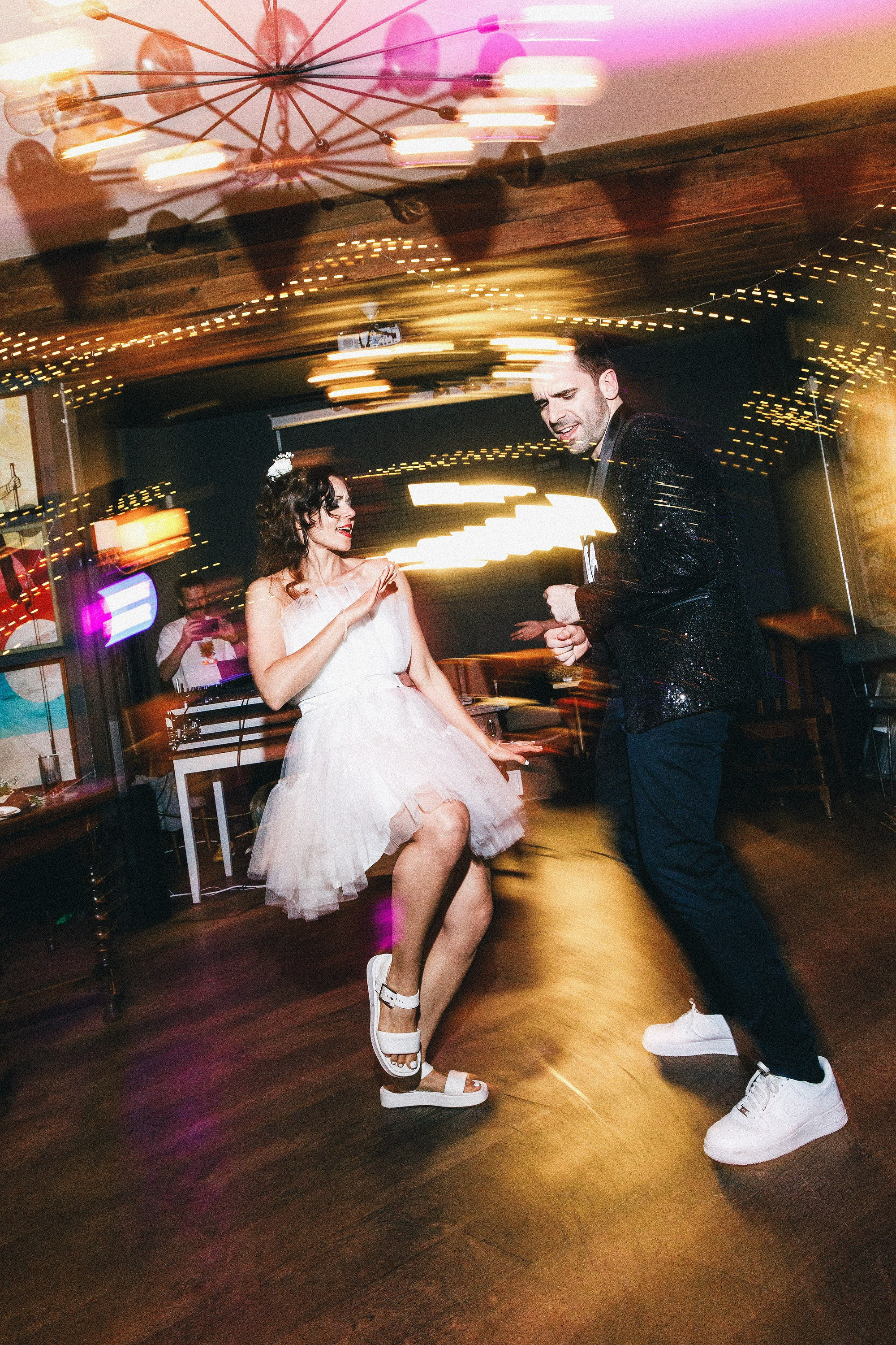 Newlyweds dancing beneath fairy lights at The Hercules, Lambeth