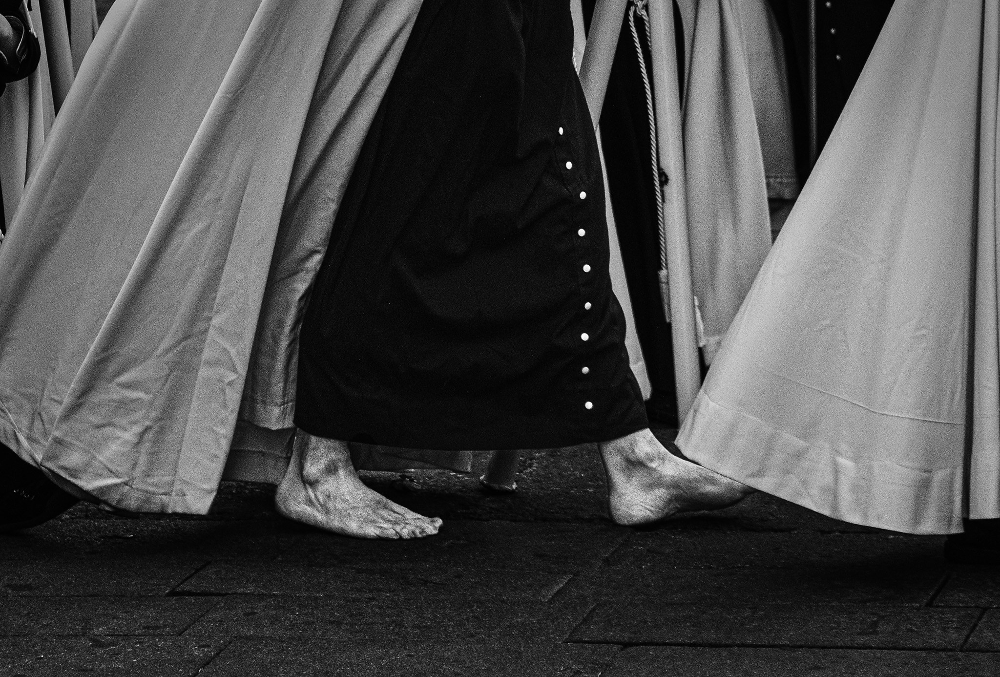 Bare feet of penitent during Holy Week procession 