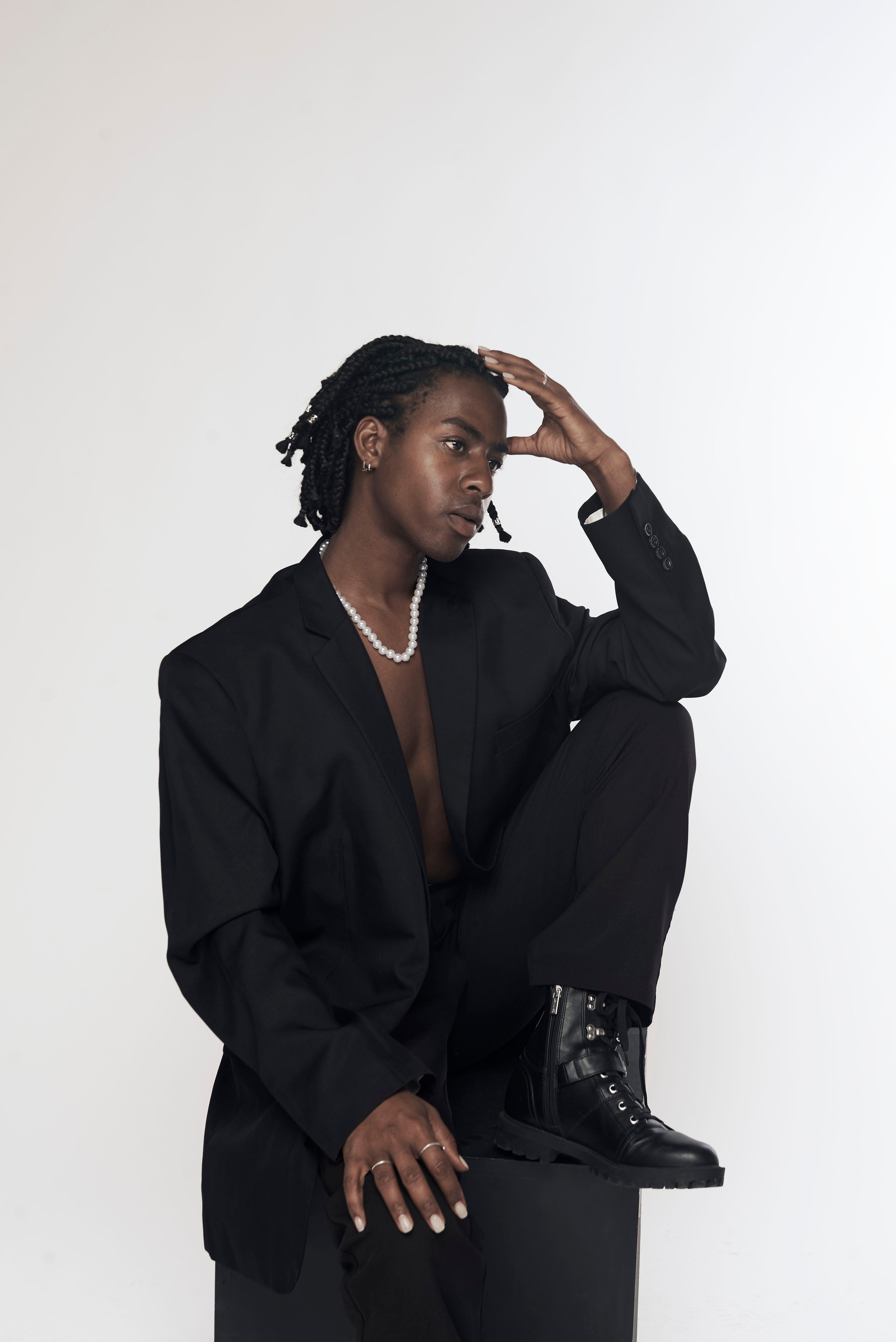 Creative studio portrait of a male model in a dramatic pose