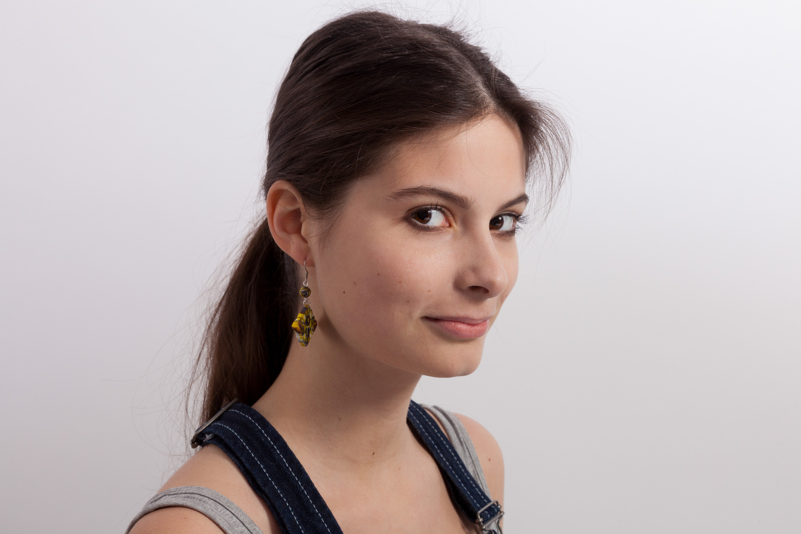 Portrait of a young girl on white studio background - photographer Andrey Dunin