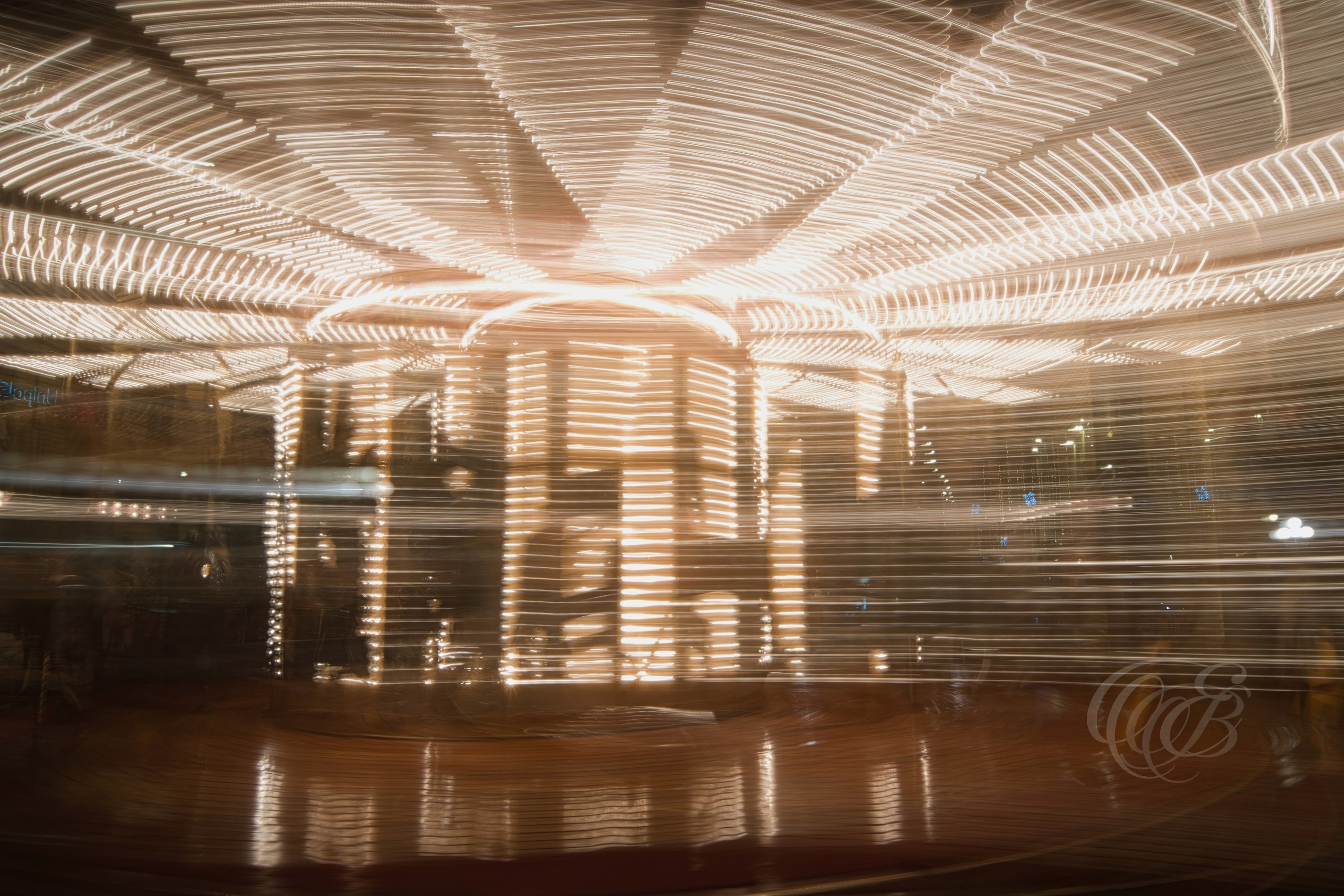 Florence, Italy—Light and motion converge in this long-exposure interpretation of a moving carousel, transforming a familiar attraction into an abstract composition of luminous forms and flowing movement. The image explores the relationship between time, movement, and visual perception within the historic setting of Florence. Eduardo Bartoli Photography.