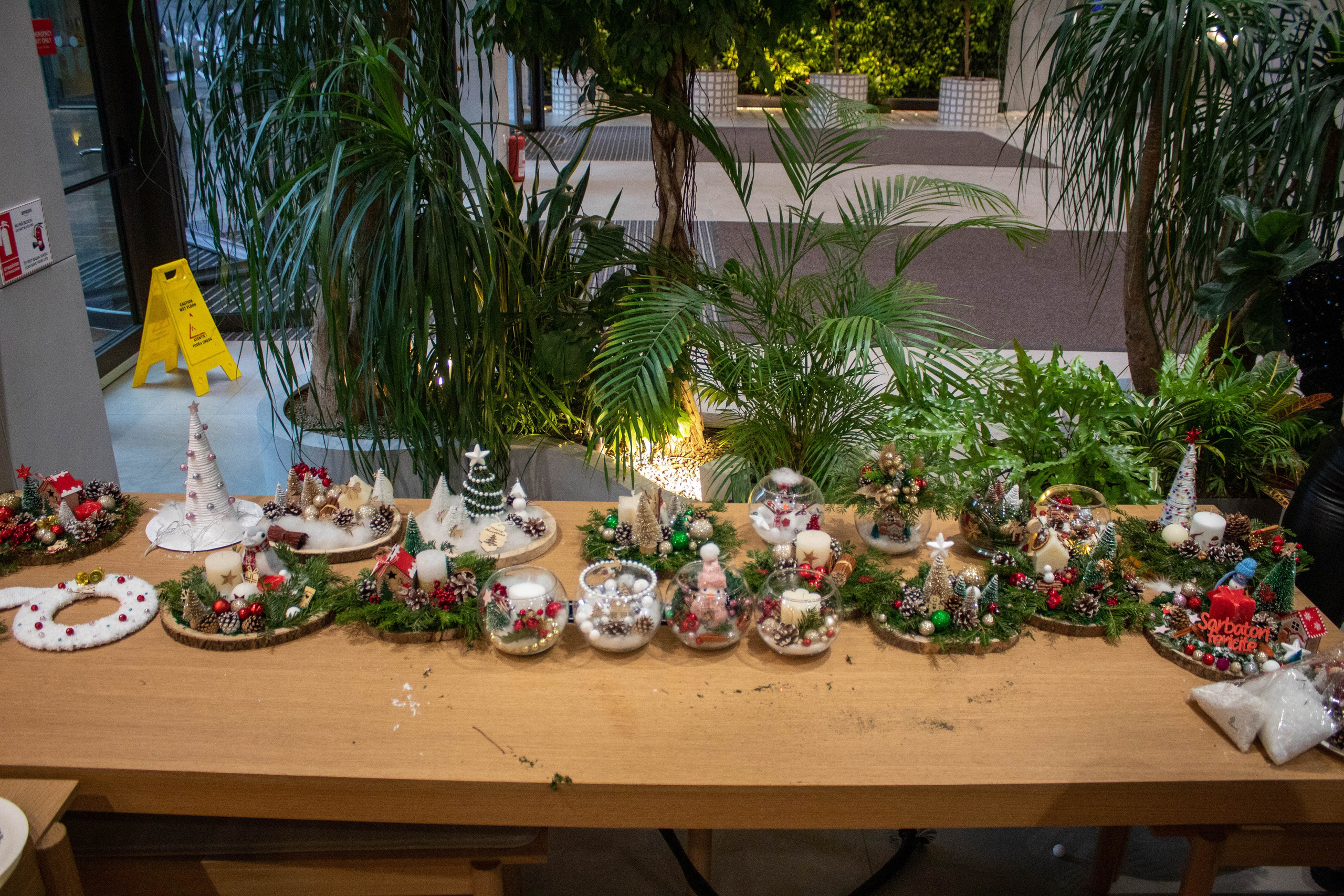 Close-up of a traditional nativity scene with figures and festive decorations.