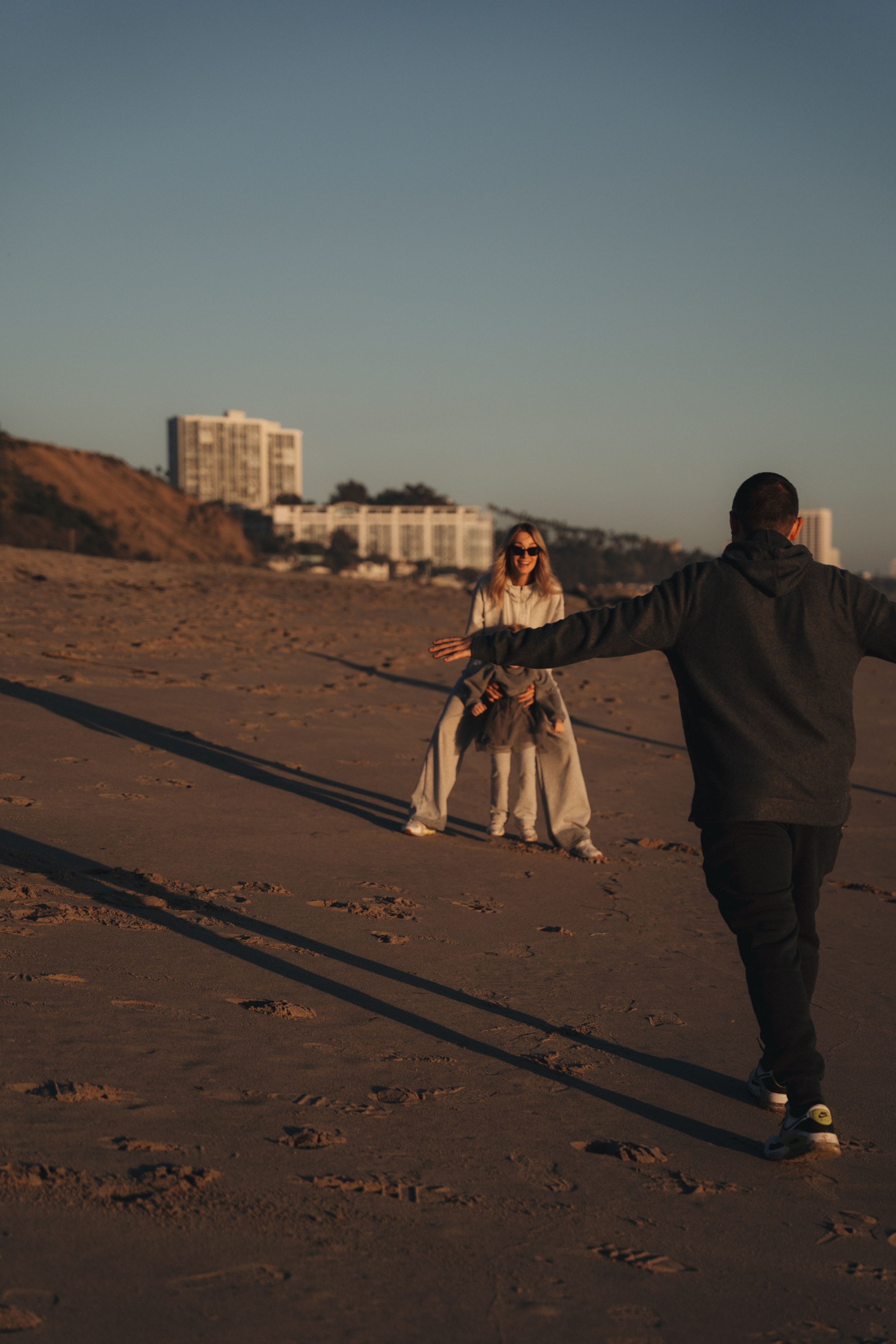 Family photoshoot. Family photoshoot outside. Beach photoshoot. Family holiday photoshoot. Sunset photoshoot