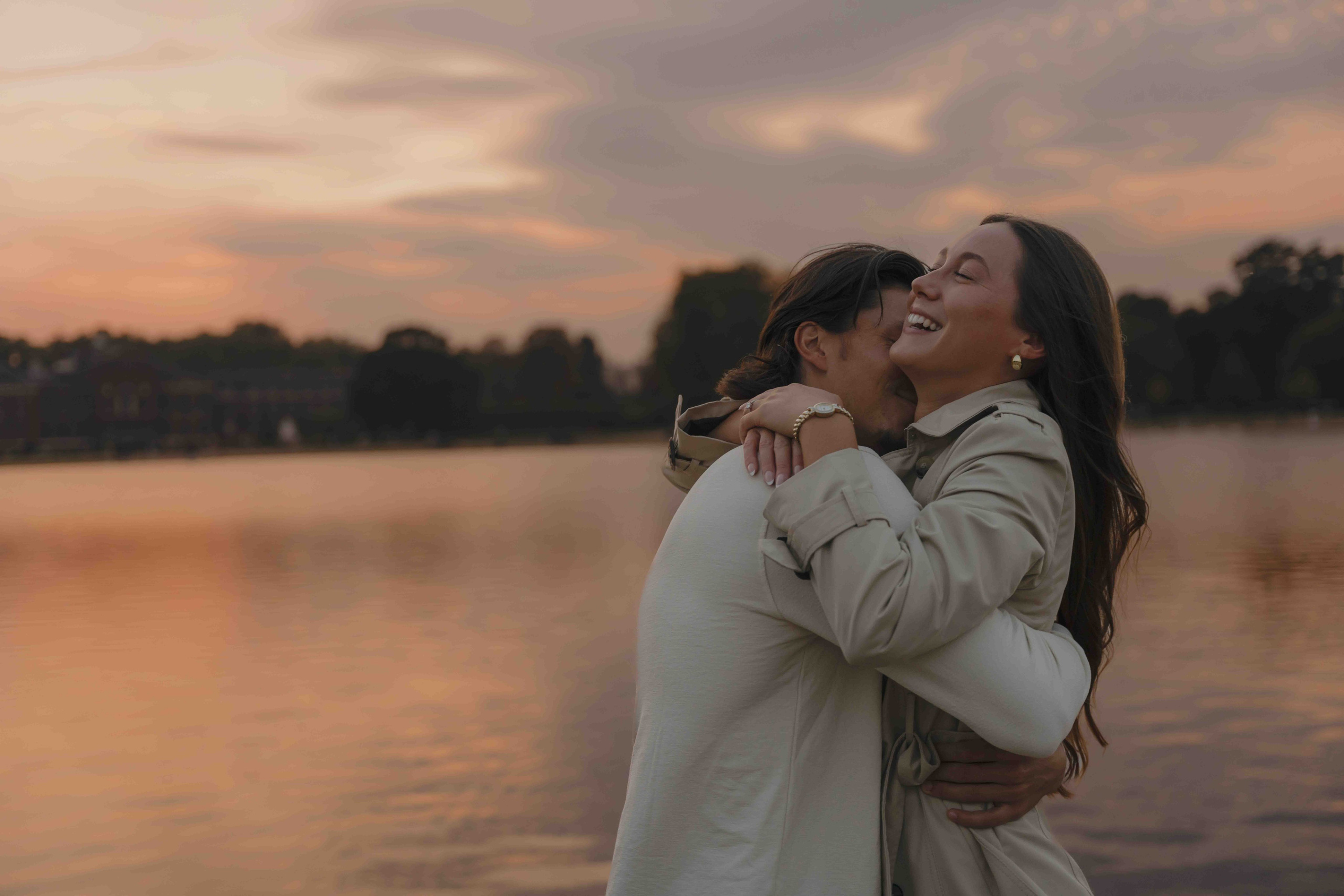 Couple hugging after proposal Kensington Gardens London romantic moment