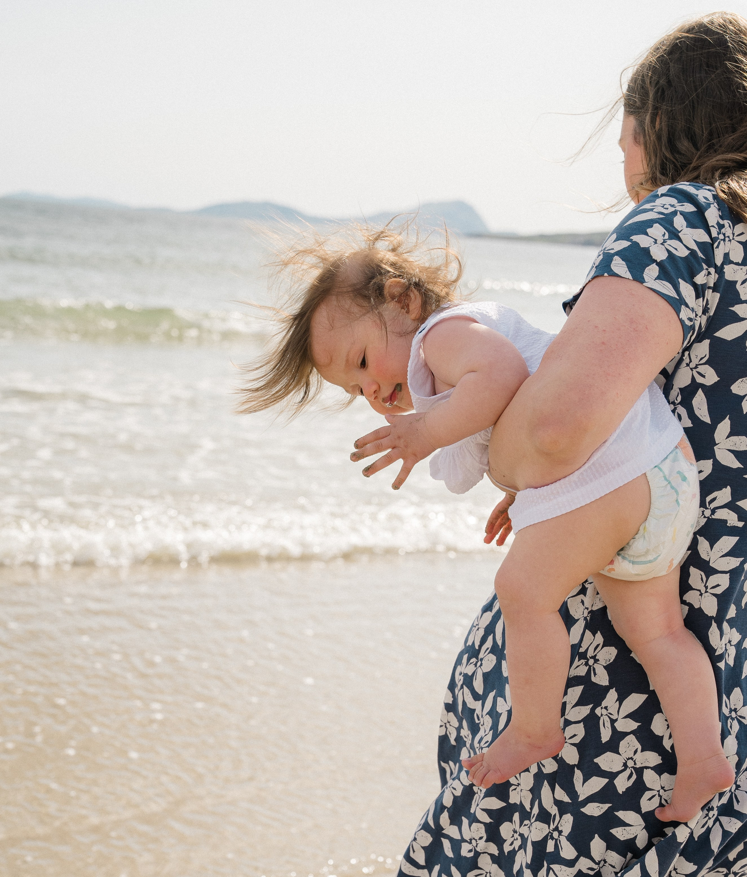 Darya and Mia at the ocean. Wedding and family photographer Ireland