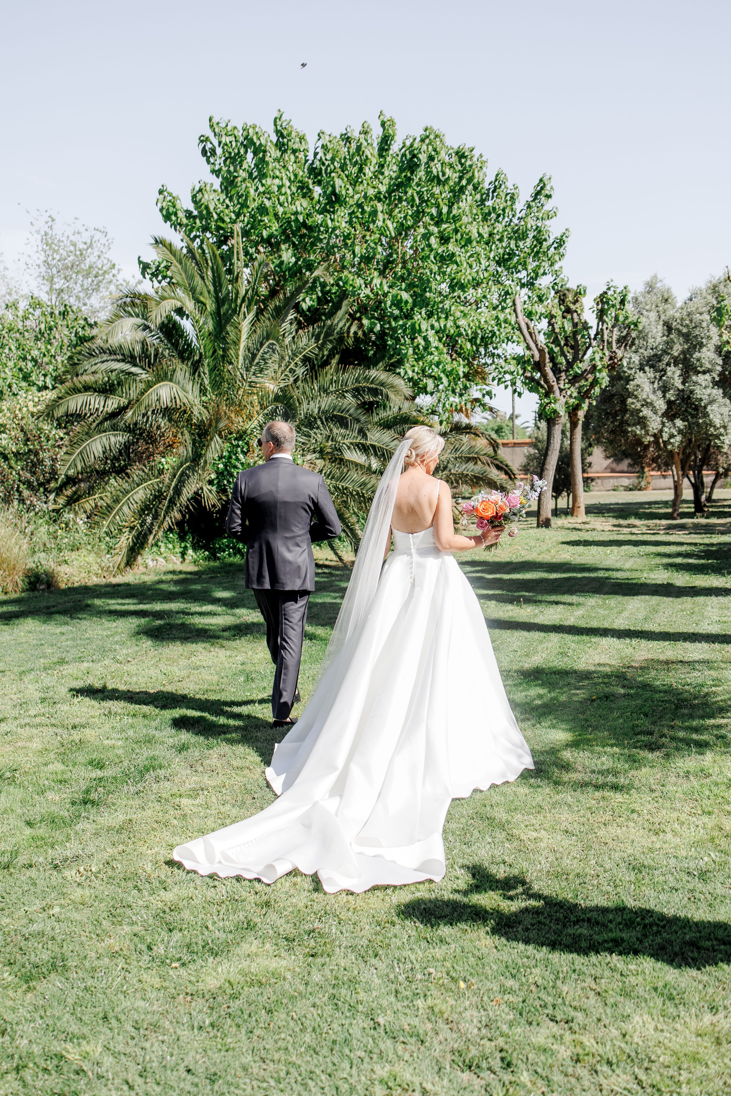 Romantic couple photo shoot in the gardens of the destination wedding venue, capturing love and joy