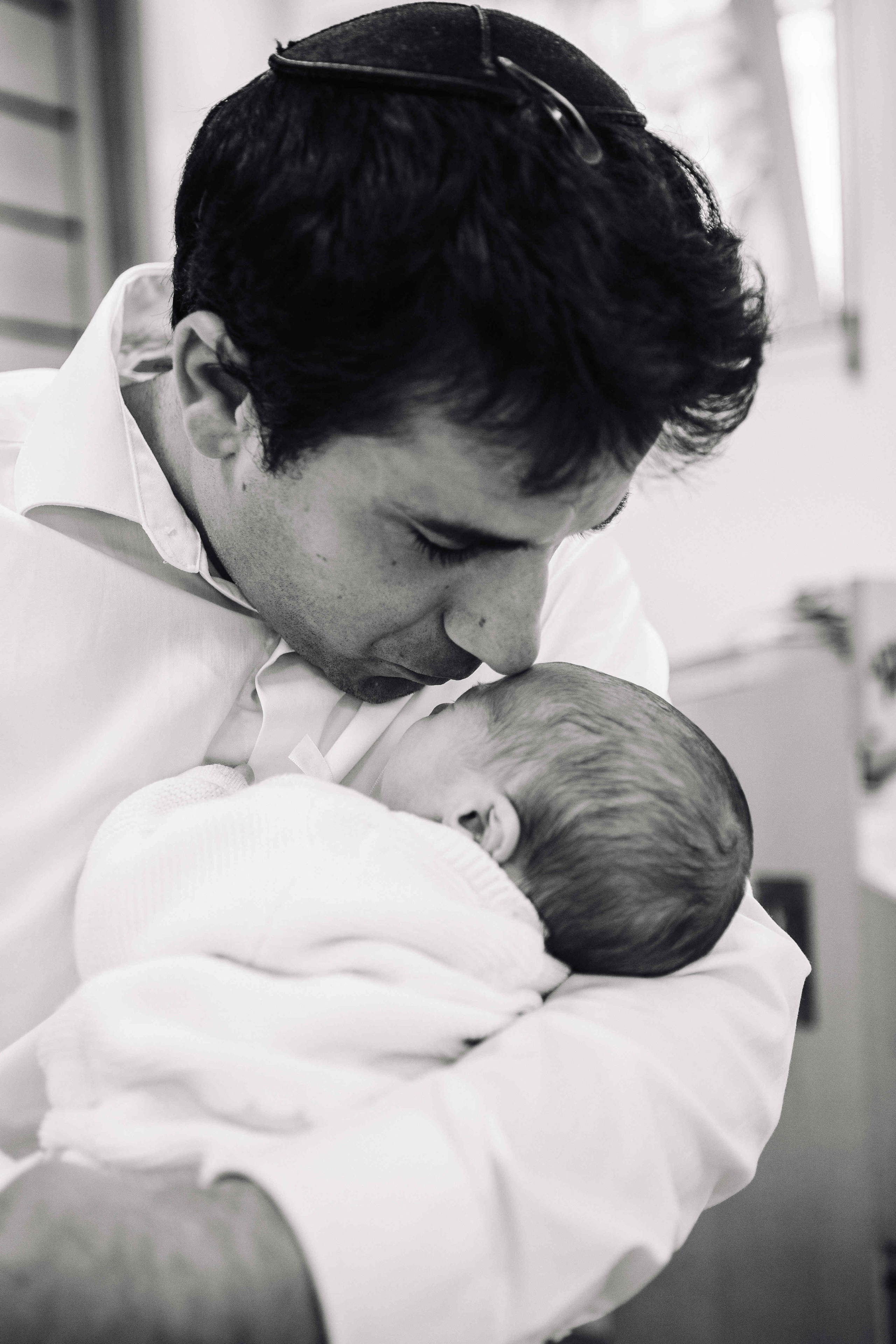BRITH MILA IN THE SMALL SYNAGOGUE. PHOTOGRAPHER IN ISRAEL