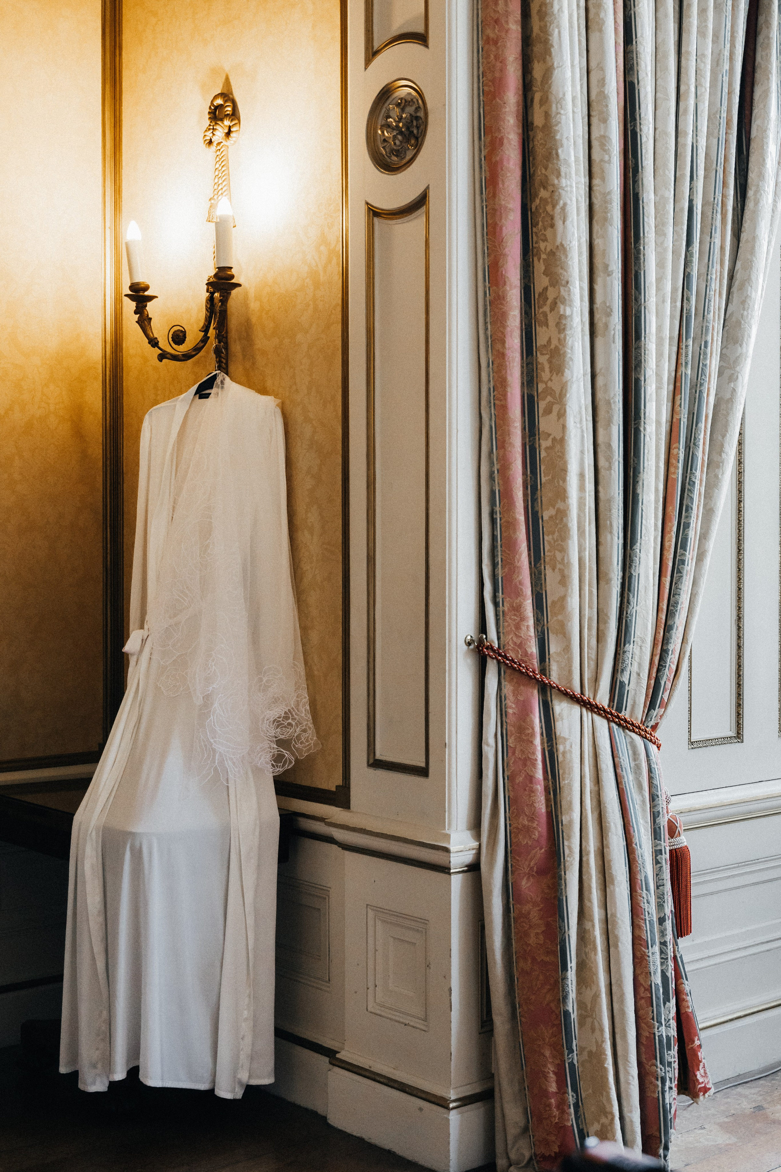 Elegant wedding portrait of bride and groom walking through the streets of ParisRomantic elopement moment captured in soft evening light in Paris, FranceLuxury wedding ceremony setup in a historic French venue with natural floralsCandid black and white photo of a couple at their city wedding in London, UKTimeless couple portrait in front of Marylebone Town Hall, LondonEditorial-style bridal preparation in a classic townhouse in the heart of LondonSoft light bridal portrait in a countryside château wedding in FranceFine art flat lay with French-inspired wedding details and vintage texturesCinematic golden hour photo at a UK estate wedding with historic architectureLuxury wedding tablescape with candles and florals at a London reception
