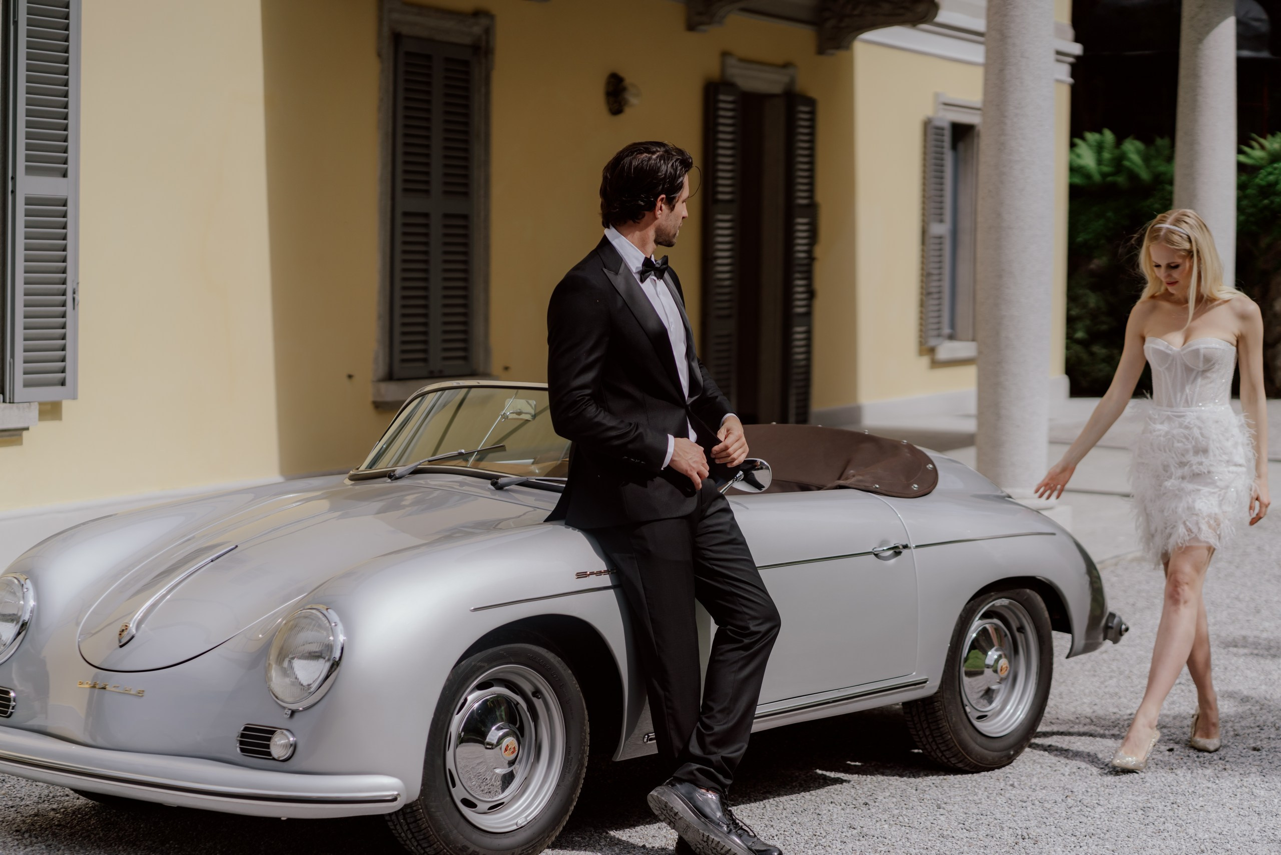 Bride and groom riding in cabriolet at Villa Aura Como wedding