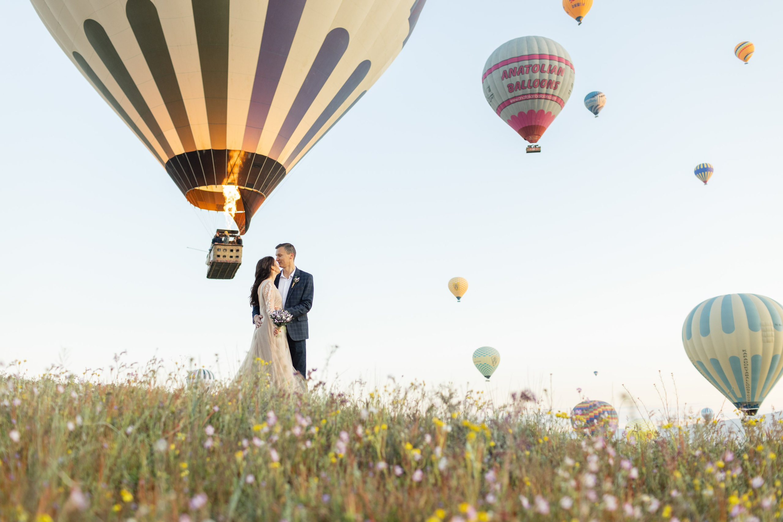 Magical Wedding Photoshoot in Cappadocia: Balloons, Caves, and Valleys. Julia Ganch I Fashion Wedding Photography I Cappadocia Turkey
